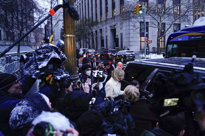 E. Jean Carroll, center, leaves Manhattan federal court following her defamation trial against former President Donald Trump, Tuesday in New York.
