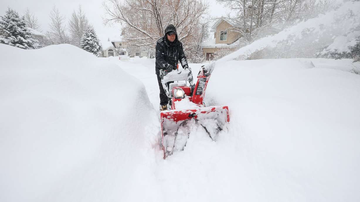 Jesus Carbaj uses a snowblower to clear a sidewalk during a snowstorm in Park City on Jan. 17, 2024. Here's a list of the top six snowfalls from a single storm, based on snow levels recorded at the Salt Lake City International Airport.