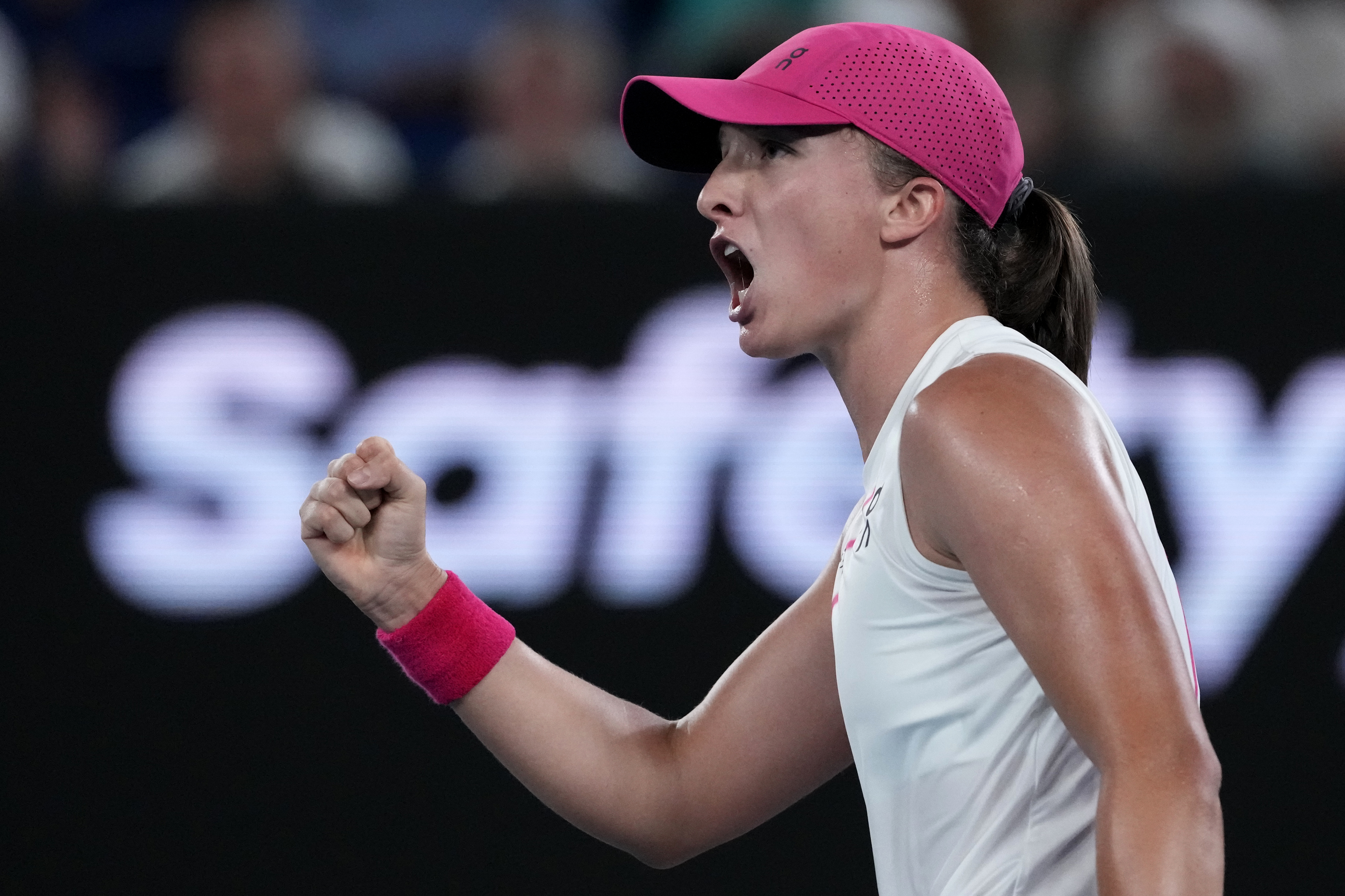 Iga Swiatek of Poland reacts after winning a point against Danielle Collins of the U.S. during their second round match at the Australian Open tennis championships at Melbourne Park, Melbourne, Australia, Thursday, Jan. 18, 2024. 