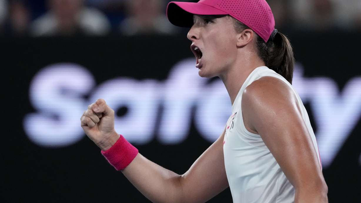 Iga Swiatek of Poland reacts after winning a point against Danielle Collins of the U.S. during their second round match at the Australian Open tennis championships at Melbourne Park, Melbourne, Australia, Thursday, Jan. 18, 2024.