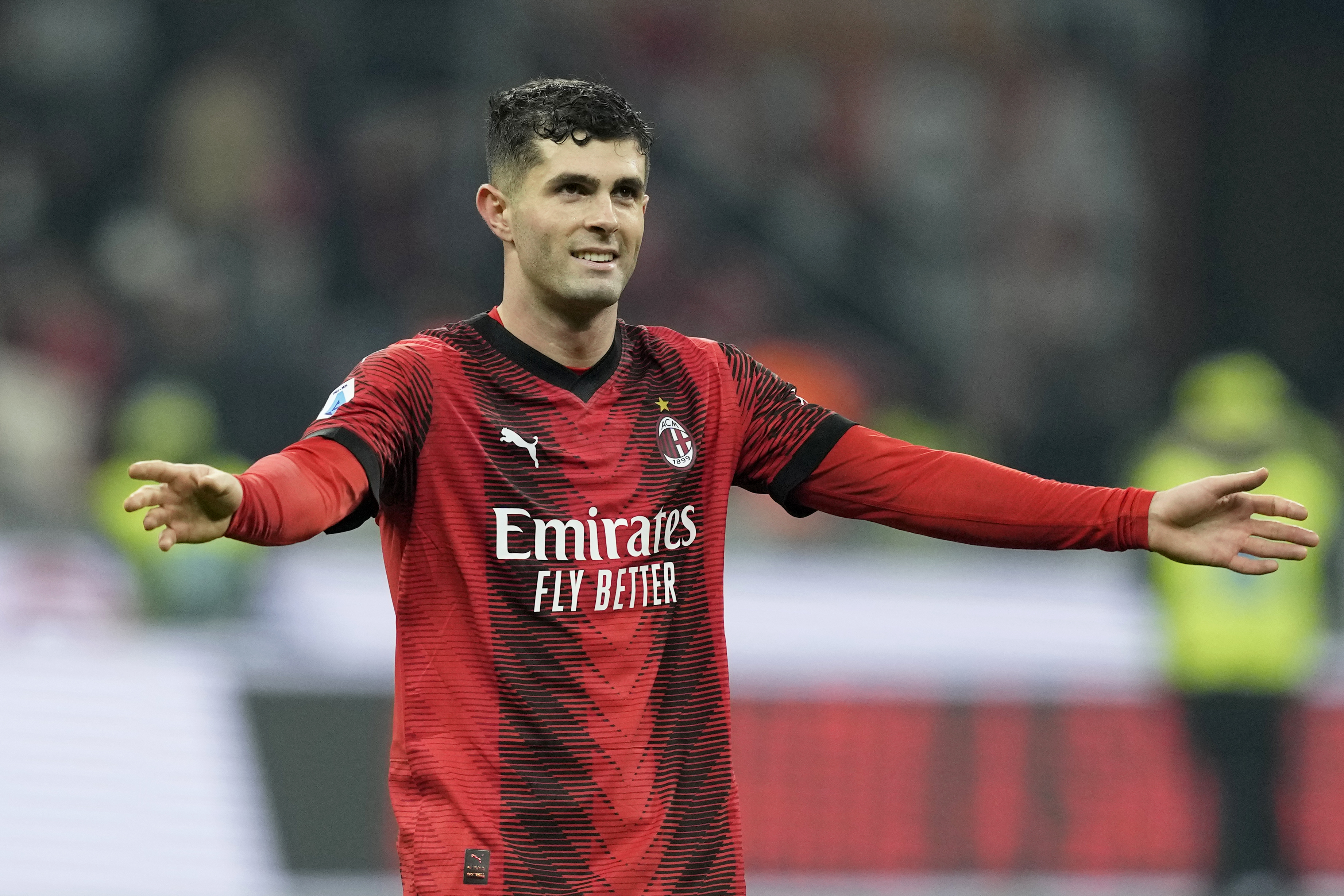 AC Milan's Christian Pulisic smiles at the end of the Serie A soccer match between AC Milan and Sassuolo at the San Siro stadium, in Milan, Italy, Saturday, Dec. 30, 2023. Pulisic scored the goal in Milan's 1-0 win.