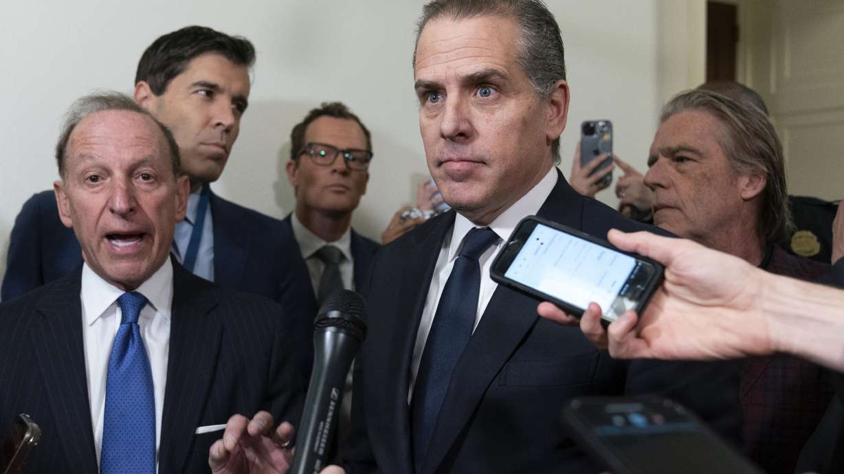 Hunter Biden, President Joe Biden's son, accompanied by his attorney Abbe Lowell, left, talks to reporters as they leave a House Oversight Committee hearing Jan. 10 on Capitol Hill in Washington.