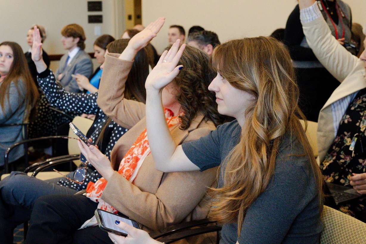 Audience members who wish to speak raise their hands during the public comment section of a proposed substitute bill, County Clerk Amendments, sponsored by Sen. Todd Weiler, R-Woods Cross, during a Senate Government Operations and Political Subdivisions Standing Committee hearing at the Utah Capitol in Salt Lake City on Thursday.