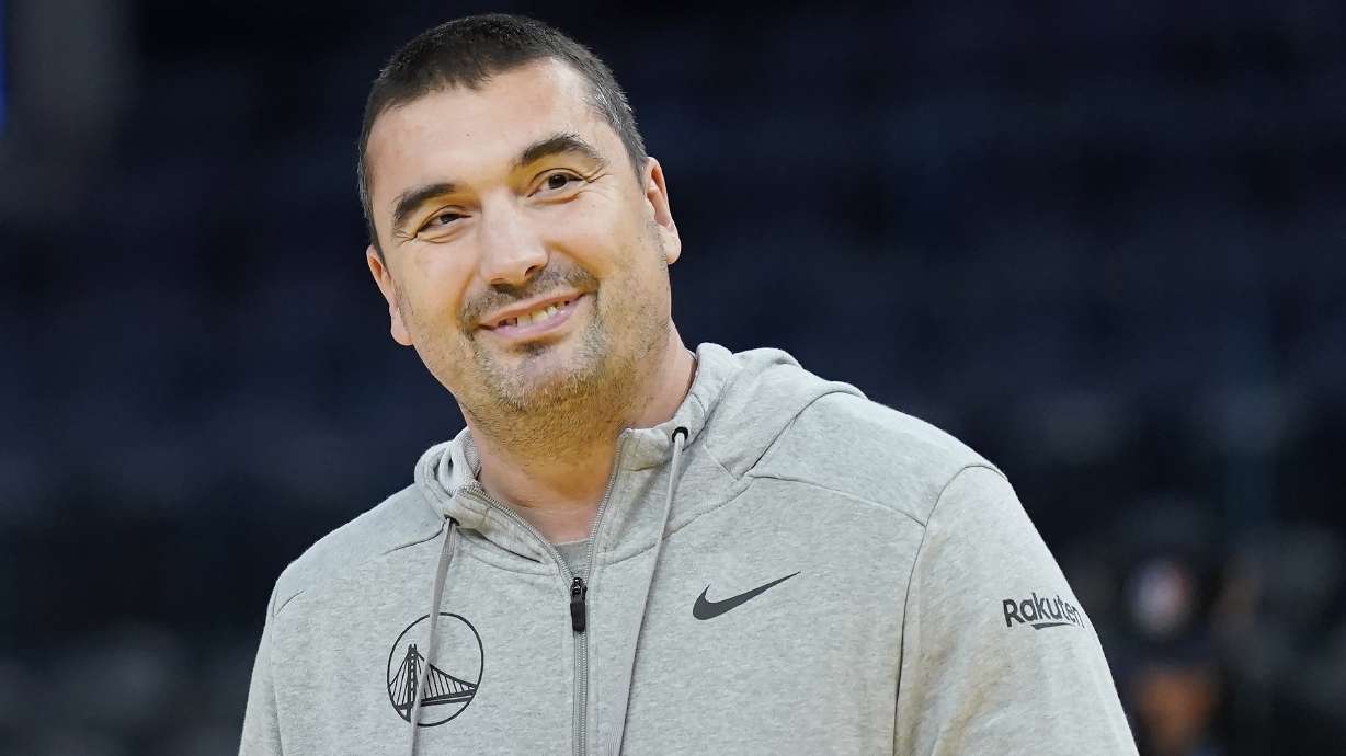 Golden State Warriors assistant coach Dejan Milojevic smiles before an NBA preseason basketball game against the Denver Nuggets in San Francisco, Friday, Oct. 14, 2022.