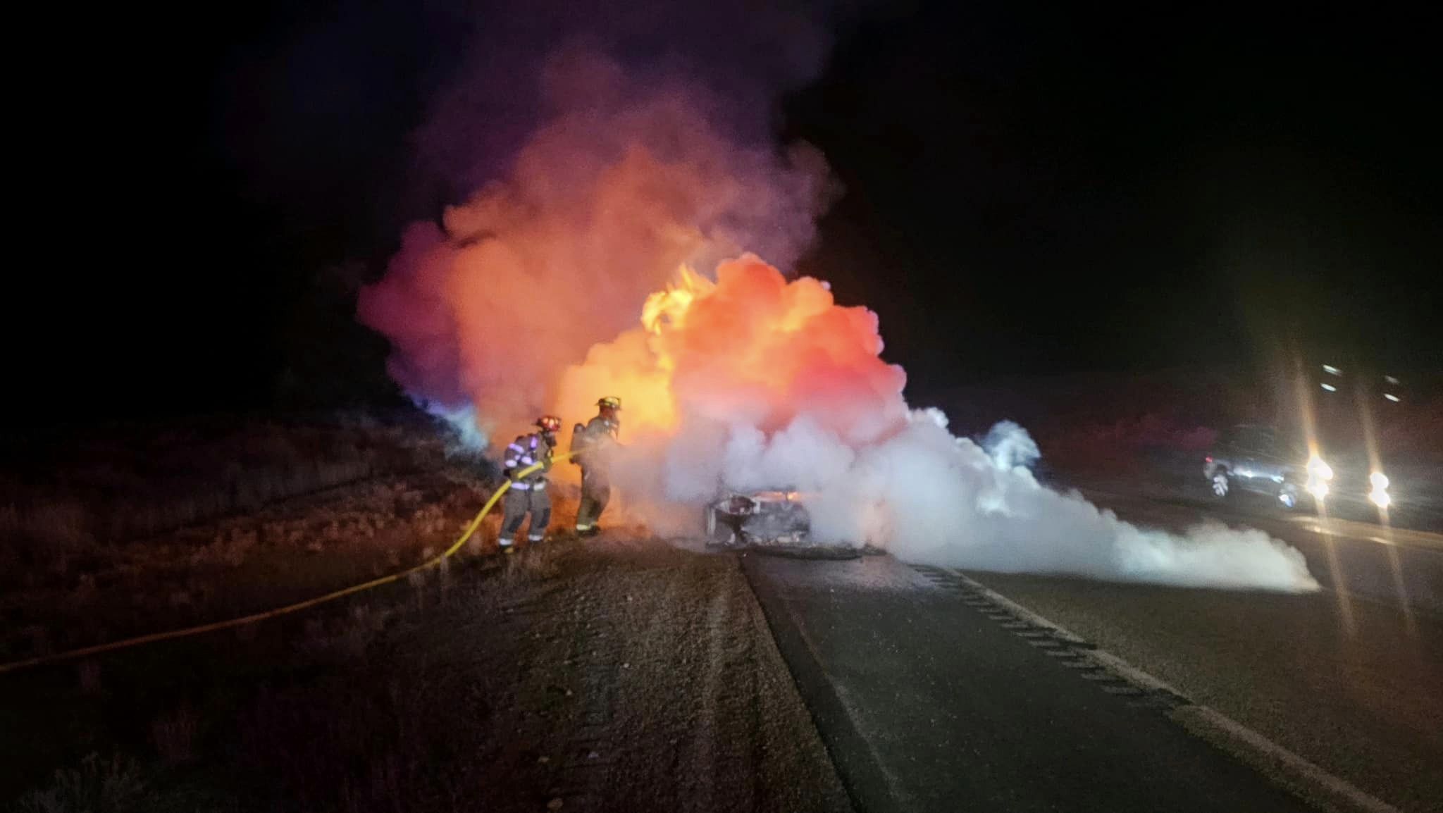 Firefighters put out Laura Hopkinson’s car fire on Highway 189 in Wyoming on Jan. 2 She says the car burned just days after the oil was changed.