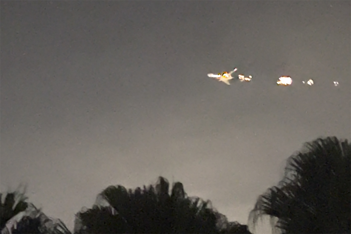 This image taken from video shows sparks shooting from a cargo plane before making an emergency landing at Miami International Airport on Thursday.