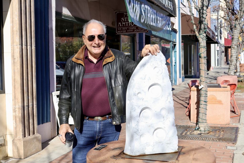 Patrick Sullivan stands with his sculpture “1960” that was installed as part of Art Around the Corner in St. George Jan. 11.