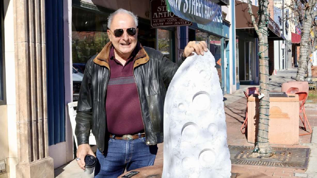 Patrick Sullivan stands with his sculpture “1960” that was installed as part of Art Around the Corner in St. George Jan. 11.