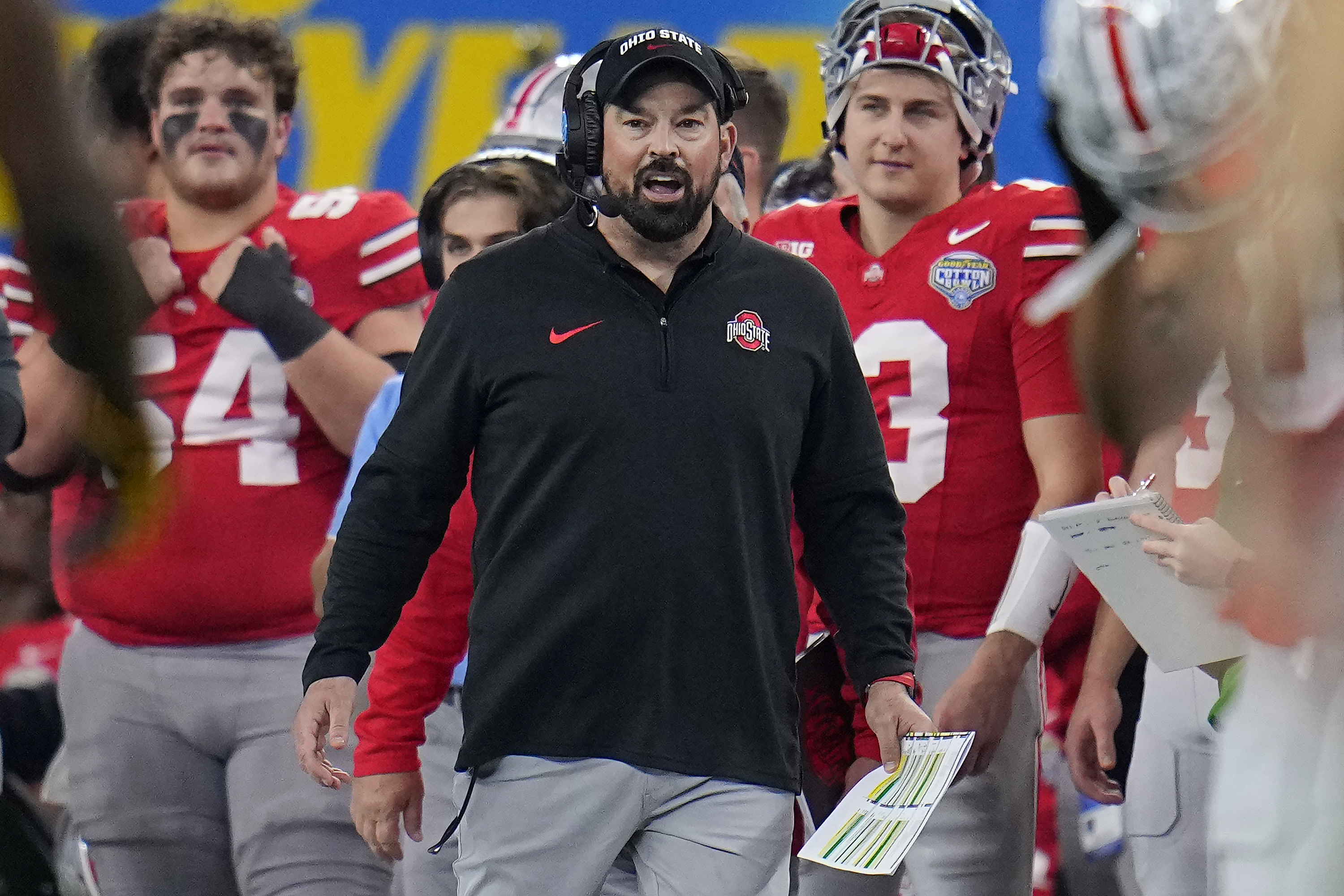 Ohio State head coach Ryan Day, center, reacts on the sideline during the second half of the Cotton Bowl NCAA college football game against Missouri, Friday, Dec. 29, 2023, in Arlington, Texas. 