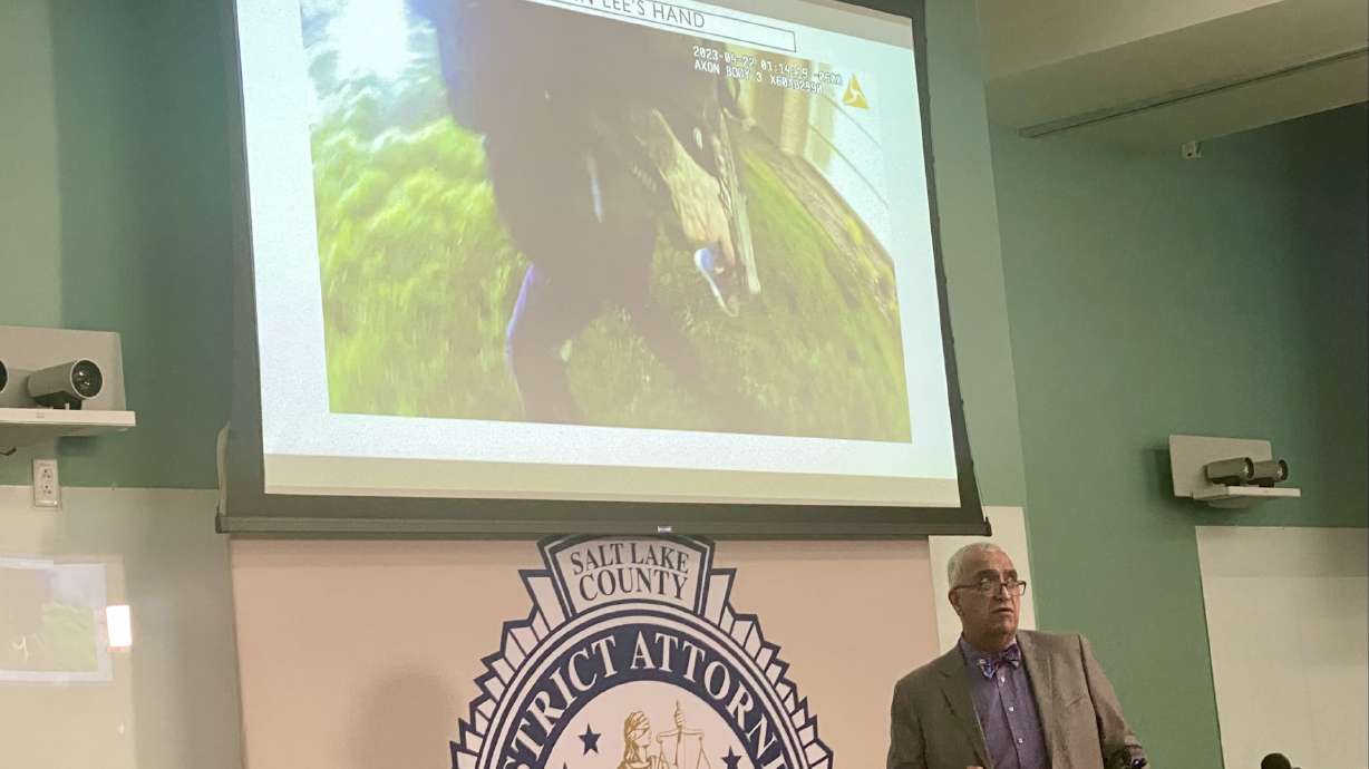 Salt Lake County District Attorney Sim Gill shows body camera video Friday while explaining why he concluded that two West Jordan police officers were legally justified in shooting and killing a man who had just shot one of the officers in the leg.