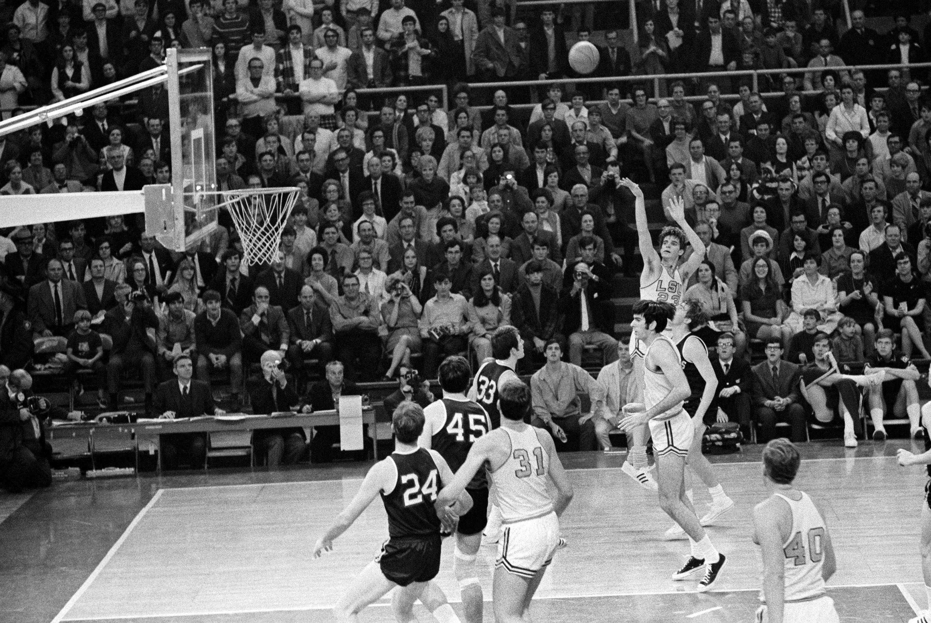 FILE - Louisiana State University's Pistol Pete Maravich (23) breaks the all-time scoring record with this shot against Mississippi in Baton Rouge, La., Jan. 31, 1970. In the 1969-70 season, Maravich produced a season at LSU that may never be matched. Despite playing in the pre-3-point era, Maravich averaged 44.5 points per game after averaging 44.2 the year before. He still holds the all-time scoring record with 3,667 career points — in three seasons. 