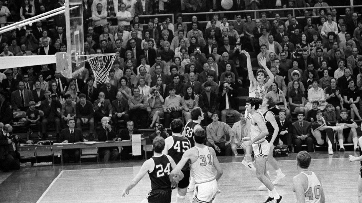FILE - Louisiana State University's Pistol Pete Maravich (23) breaks the all-time scoring record with this shot against Mississippi in Baton Rouge, La., Jan. 31, 1970. In the 1969-70 season, Maravich produced a season at LSU that may never be matched. Despite playing in the pre-3-point era, Maravich averaged 44.5 points per game after averaging 44.2 the year before. He still holds the all-time scoring record with 3,667 career points — in three seasons.