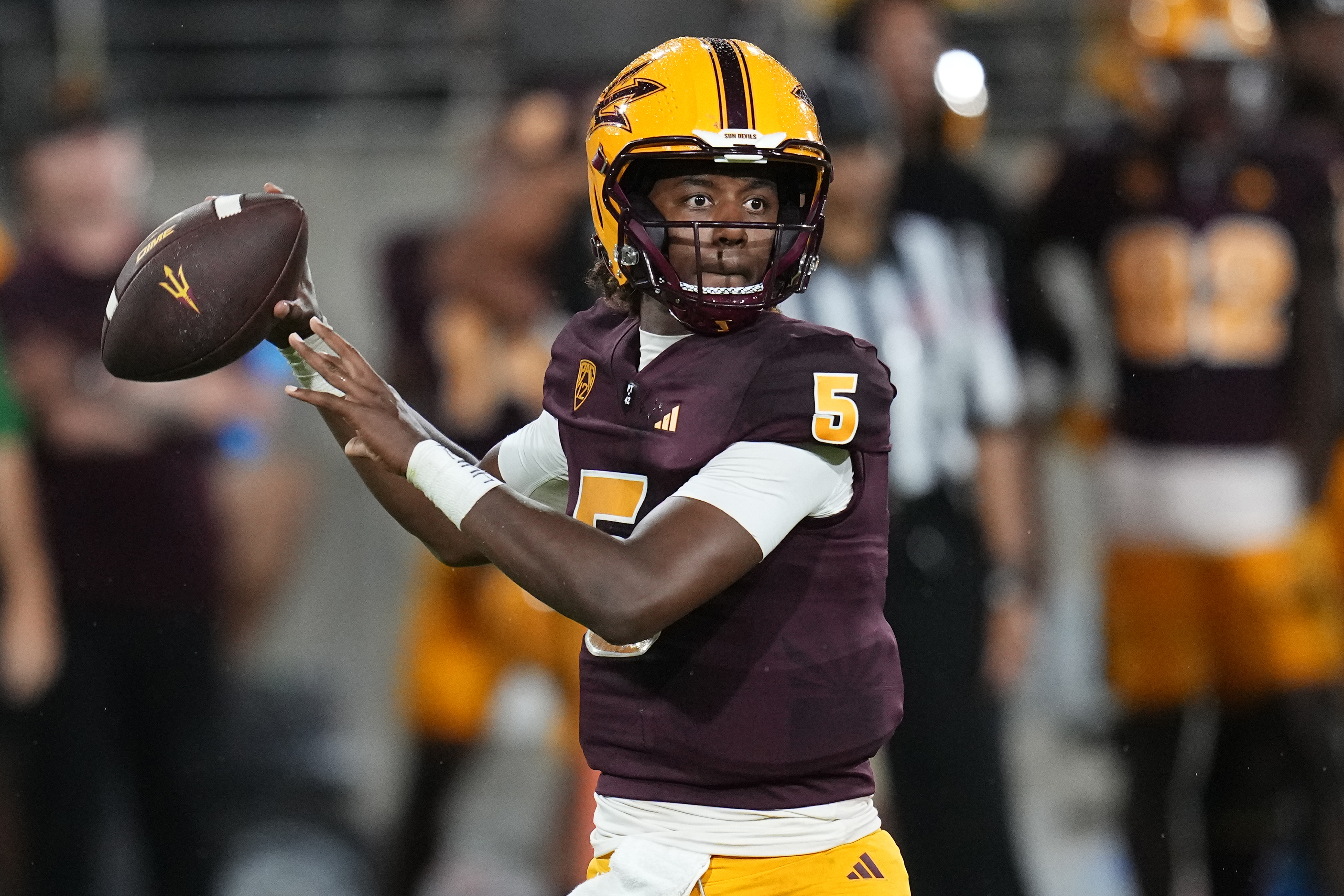 FILE - Arizona State quarterback Jaden Rashada looks for a receiver during the team's NCAA college football game against Southern Utah on Sept. 1, 2023, in Tempe, Ariz. Florida is under NCAA investigation a year after a failed name, image and likeness deal worth more than $13 million with former signee Rashada. Rashada signed with Florida last December only to be granted his release a month later after his NIL deal fell through. He later signed with Arizona State. 