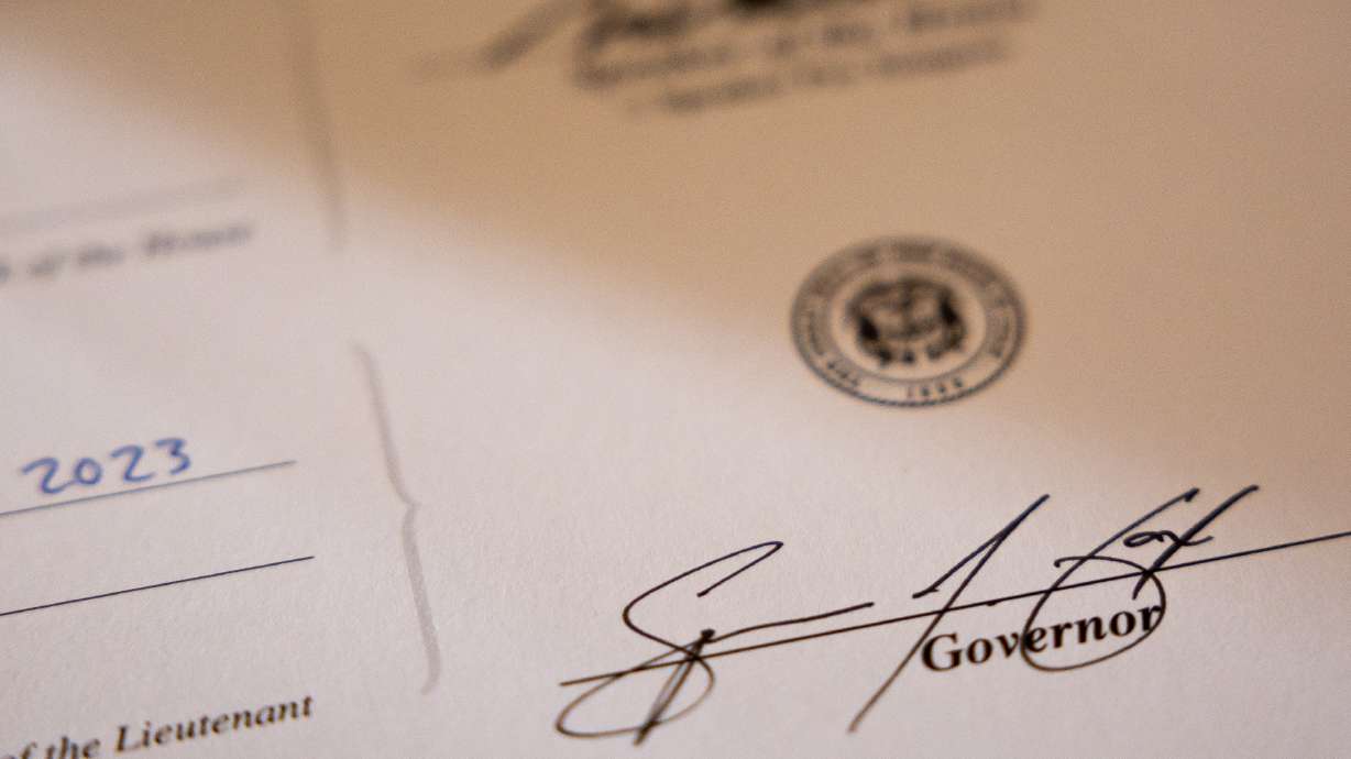 Gov. Spencer Cox’s signature at the Capitol in Salt Lake City on March 22, 2023. Utahns can expect to pay less in income taxes next year after Cox signed a bill cutting the state's income tax rate for the sixth straight year.