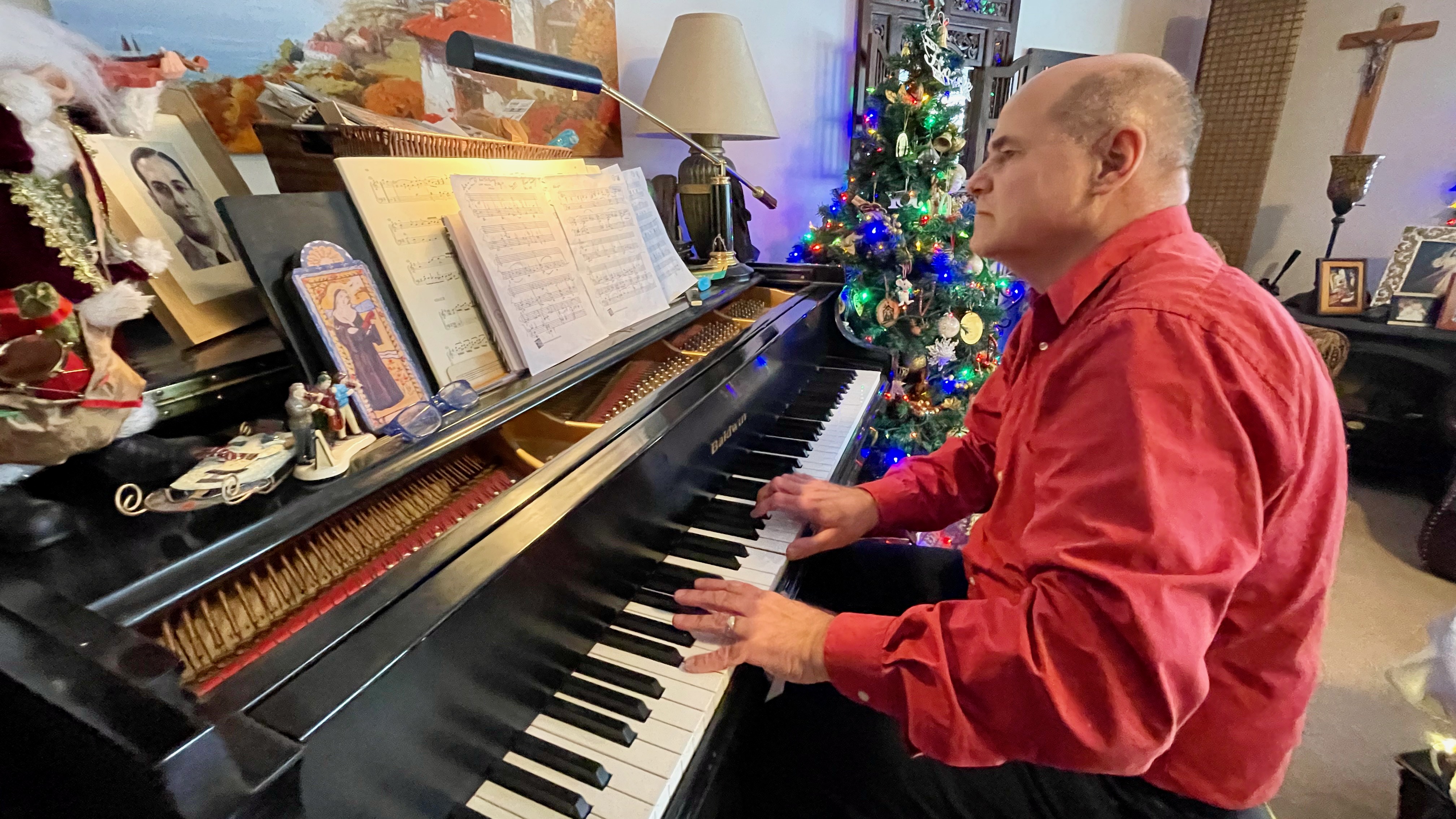 Ogden-based composer Alfonso Tenreiro plays the piano at his home on Wednesday. He is originally from Venezuela and injects musical influences from his native country into his music.