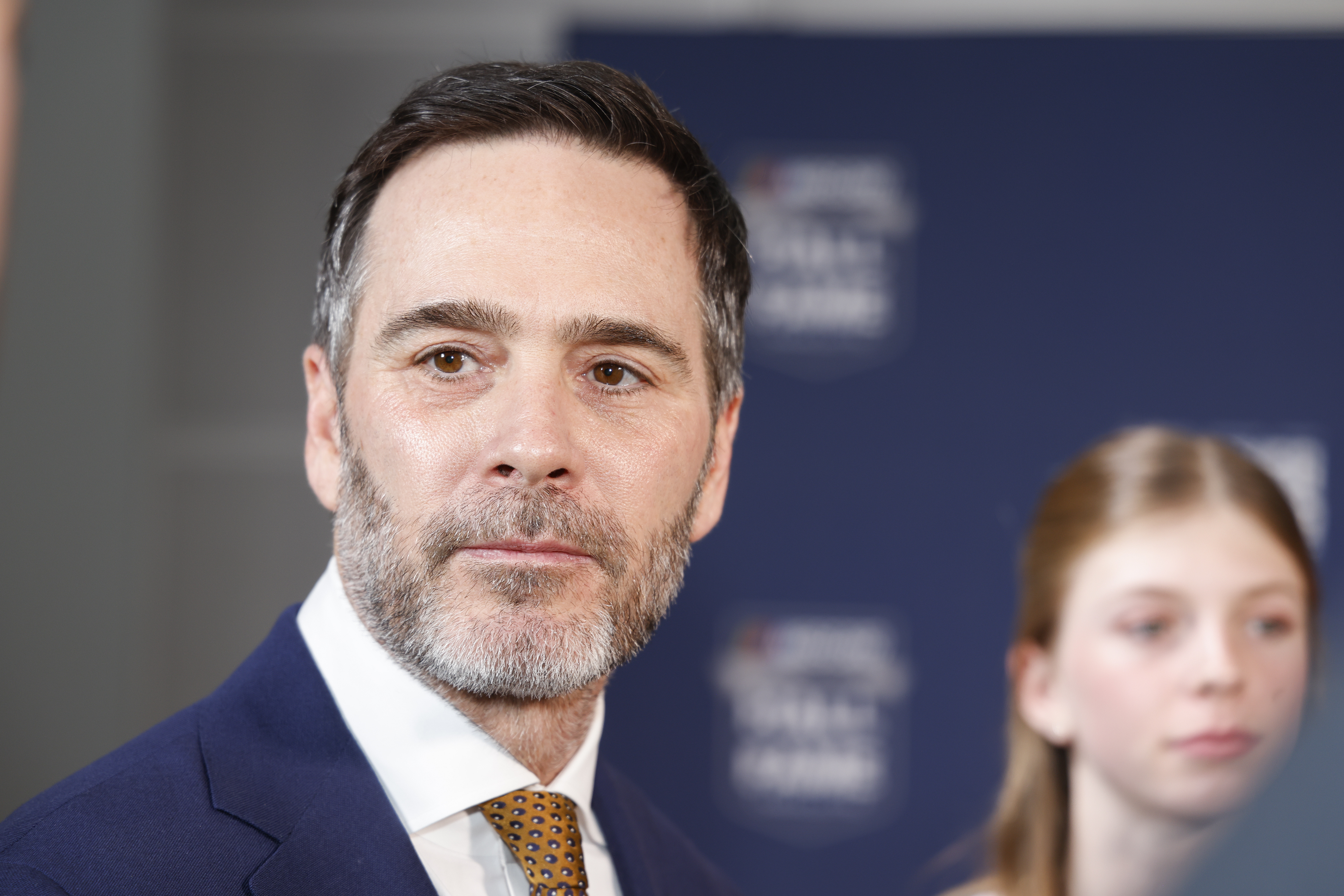 Jimmie Johnson talks to the media as he arrives for his induction into the NASCAR Hall of Fame in Charlotte, N.C., Friday, Jan. 19, 2024.