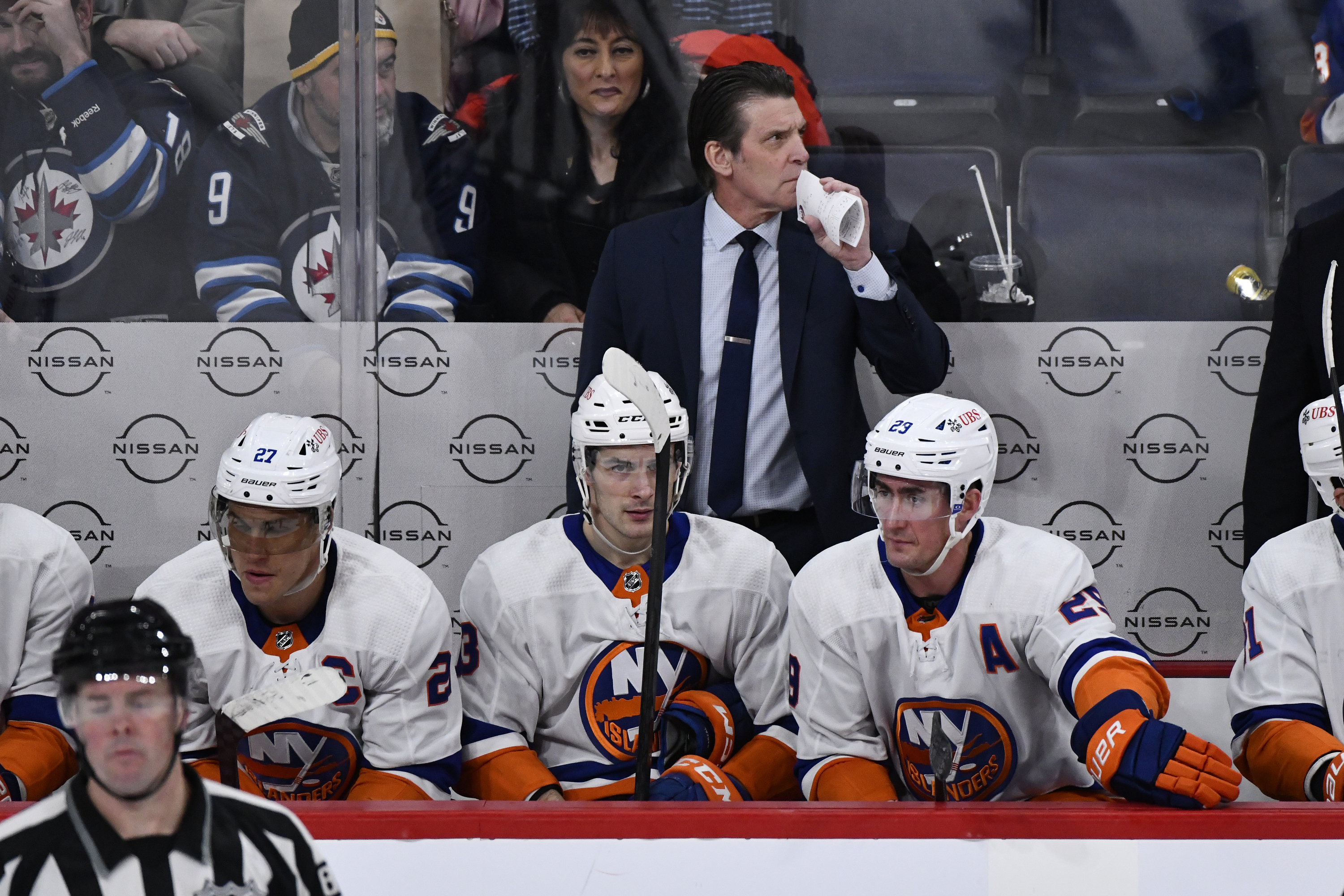 New York Islanders coach Lane Lambert watches play against the Winnipeg Jets during the third period of an NHL hockey game Tuesday, Jan. 16, 2024, in Winnipeg, Manitoba. 