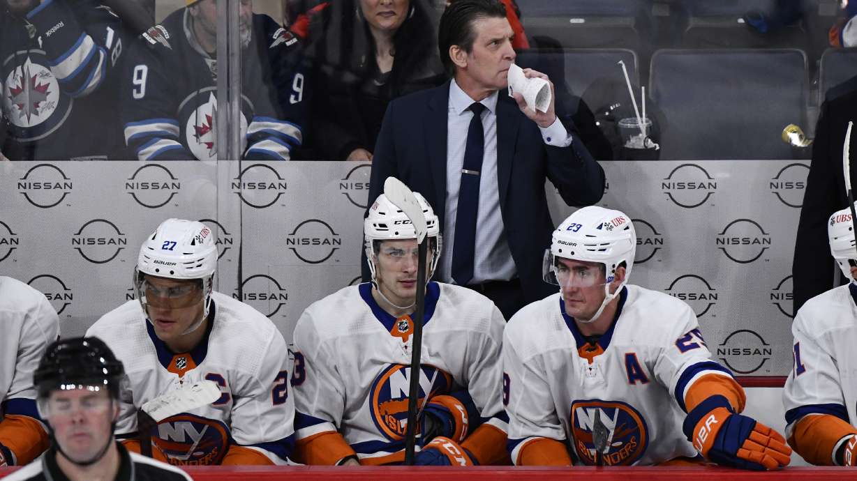 New York Islanders coach Lane Lambert watches play against the Winnipeg Jets during the third period of an NHL hockey game Tuesday, Jan. 16, 2024, in Winnipeg, Manitoba.