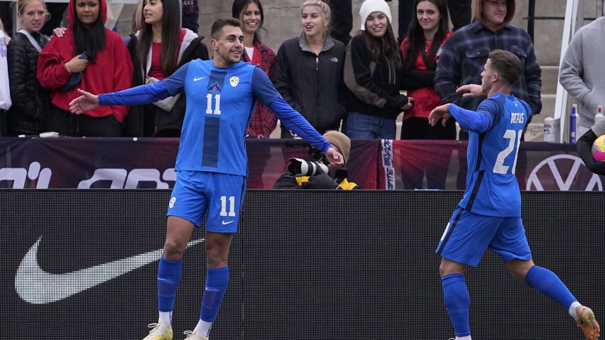 Slovenia forward Nejc Gradisar (11) celebrates his goal with teammate Matija Kavcic (21) during the first half of an international friendly soccer match against the United States in San Antonio, Saturday, Jan. 20, 2024.