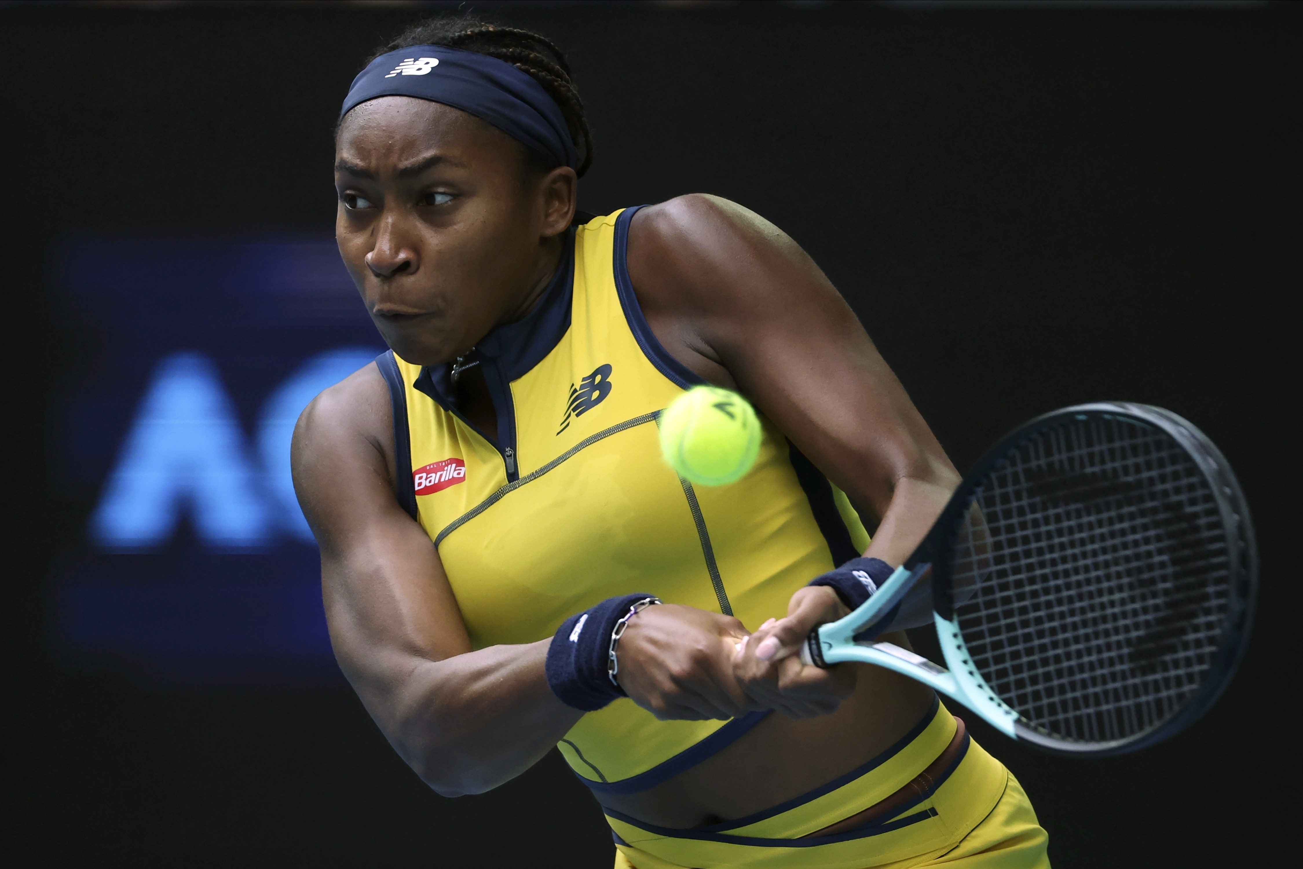 Coco Gauff of the U.S. plays a backhand return to Magdalena Frech of Poland during their fourth round match at the Australian Open tennis championships at Melbourne Park, Melbourne, Australia, Sunday, Jan. 21, 2024. 