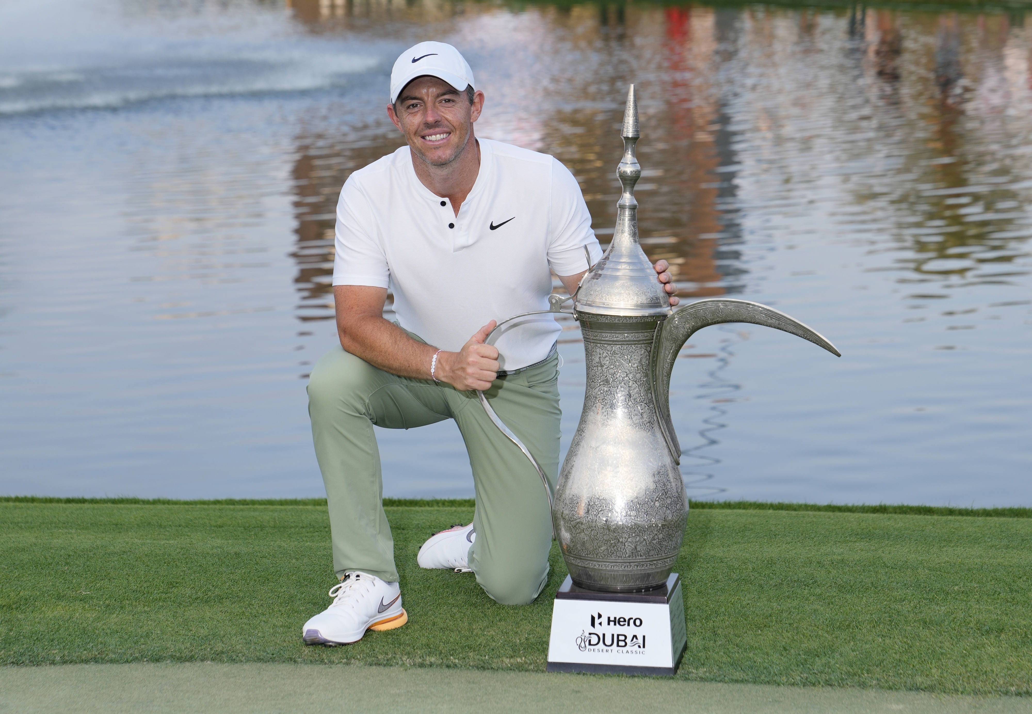 Rory McIlroy of Northern Ireland poses with his trophy after he won the final round of the Hero Dubai Desert Classic golf tournament, in Dubai, United Arab Emirates, Sunday, Jan. 21, 2024. 