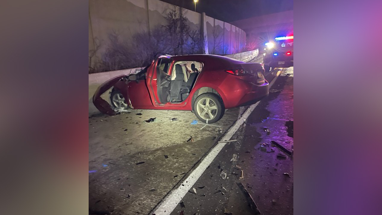 A woman is dead after the red Mazda sedan she was driving collided head-on with a black SUV on an I-80 off-ramp in Salt Lake City early Sunday.