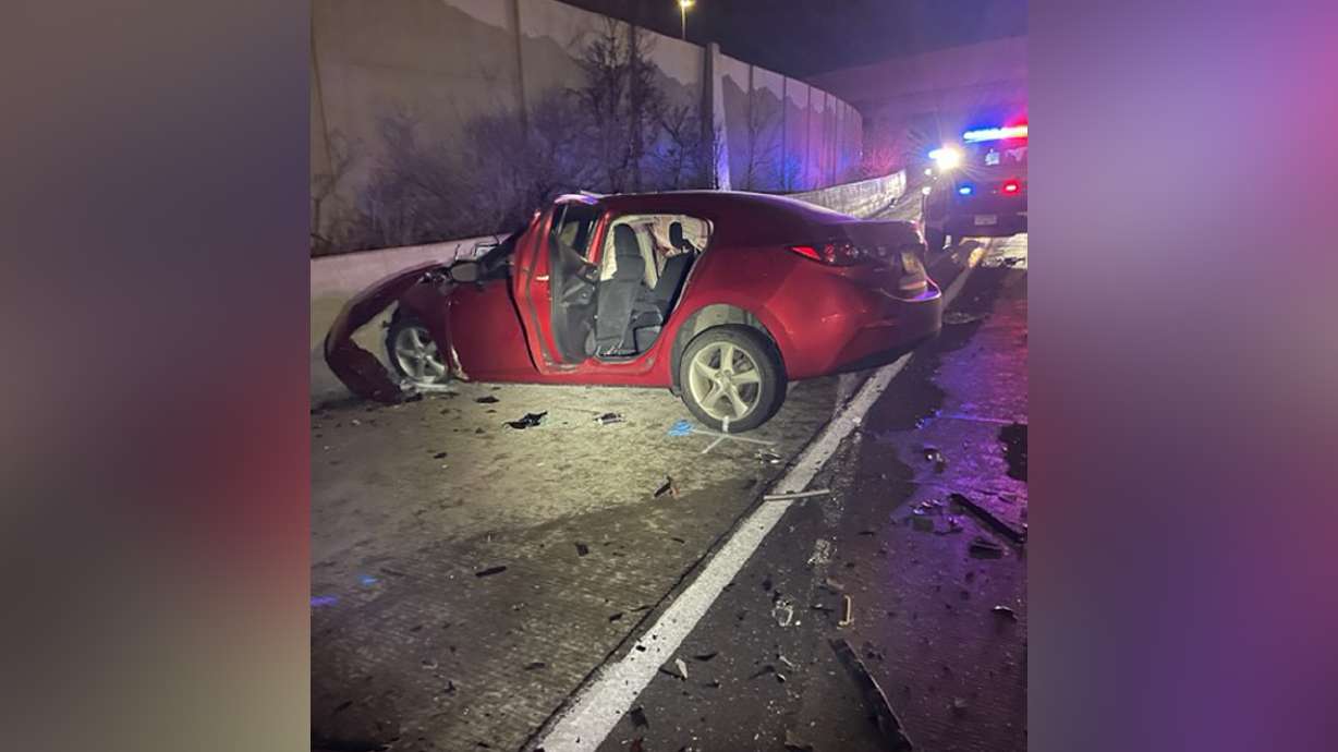 A woman is dead after the red Mazda sedan she was driving collided head-on with a black SUV on an I-80 off-ramp in Salt Lake City early Sunday.
