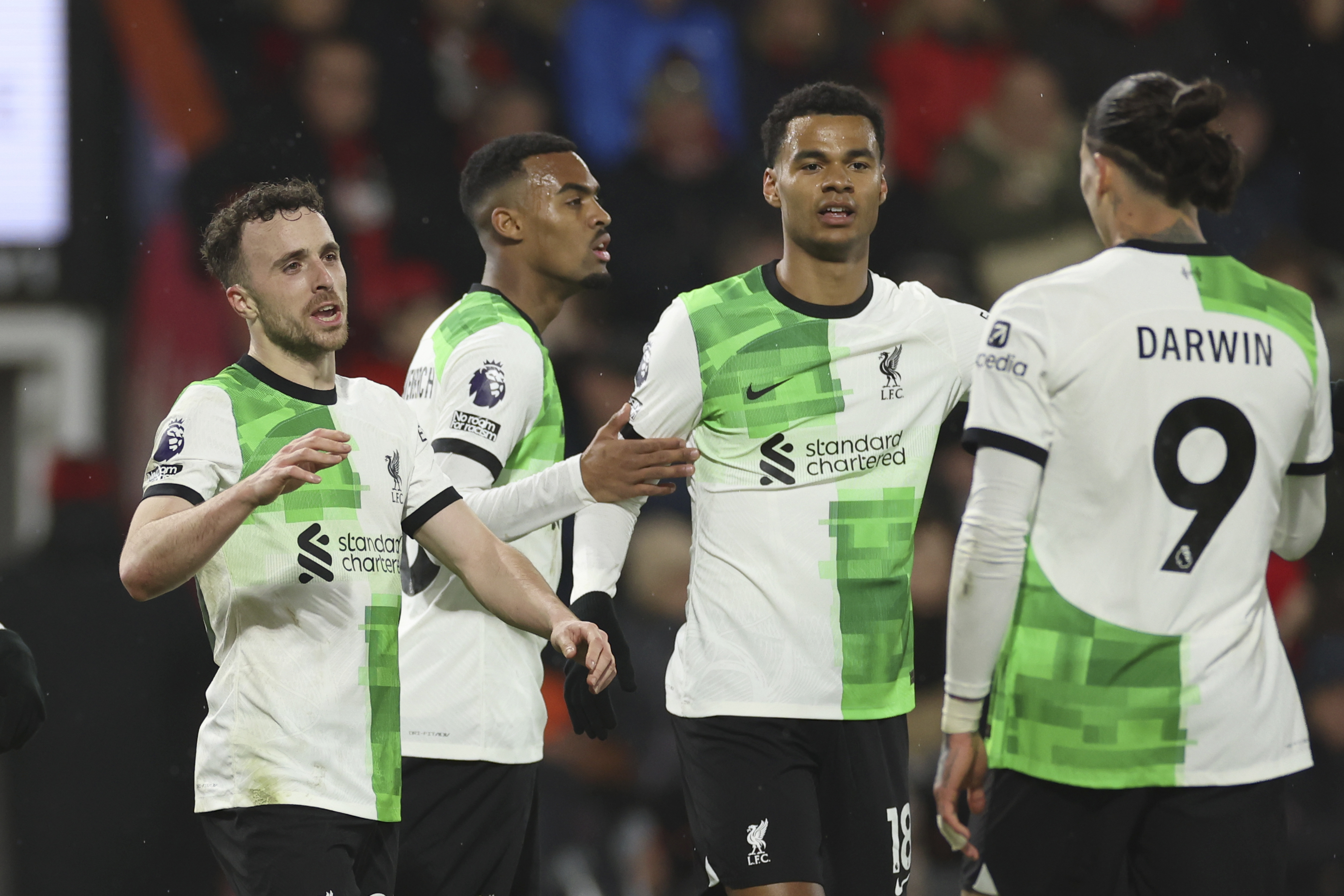 Liverpool's Diogo Jota, left, celebrates with teammates after scoring his side's second goal during the English Premier League soccer match between AFC Bournemouth and Liverpool at the Vitality Stadium, in Bournemouth, England, Sunday, Jan. 21, 2024. 