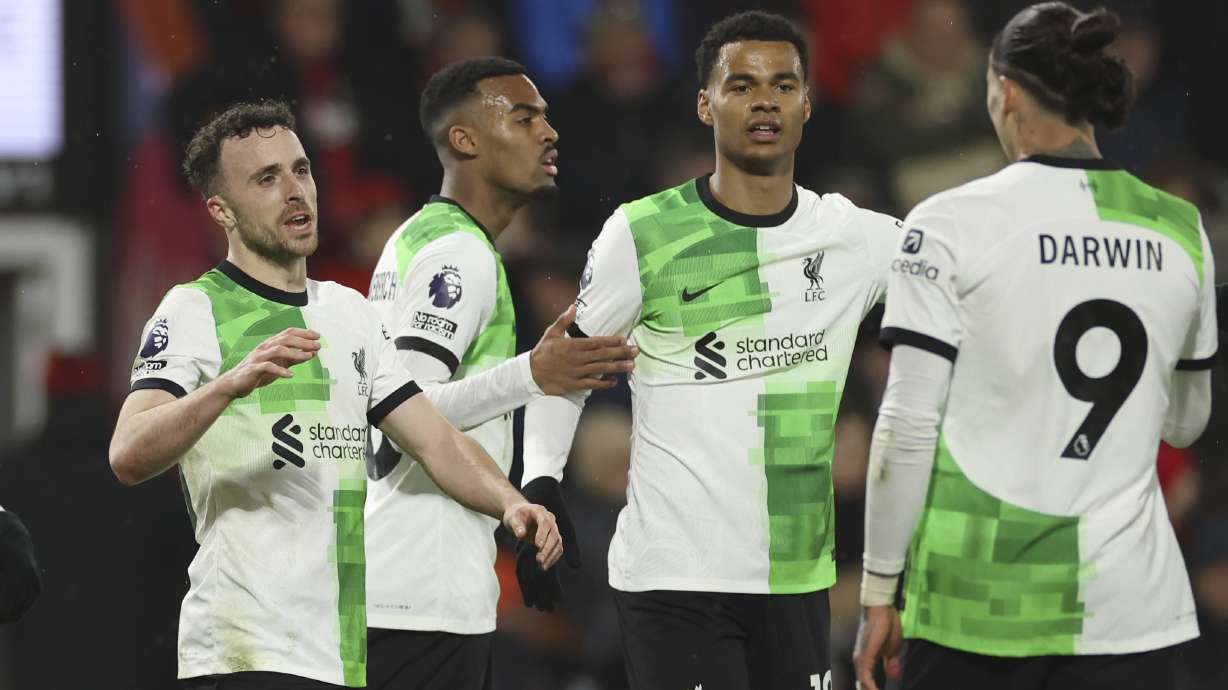 Liverpool's Diogo Jota, left, celebrates with teammates after scoring his side's second goal during the English Premier League soccer match between AFC Bournemouth and Liverpool at the Vitality Stadium, in Bournemouth, England, Sunday, Jan. 21, 2024.