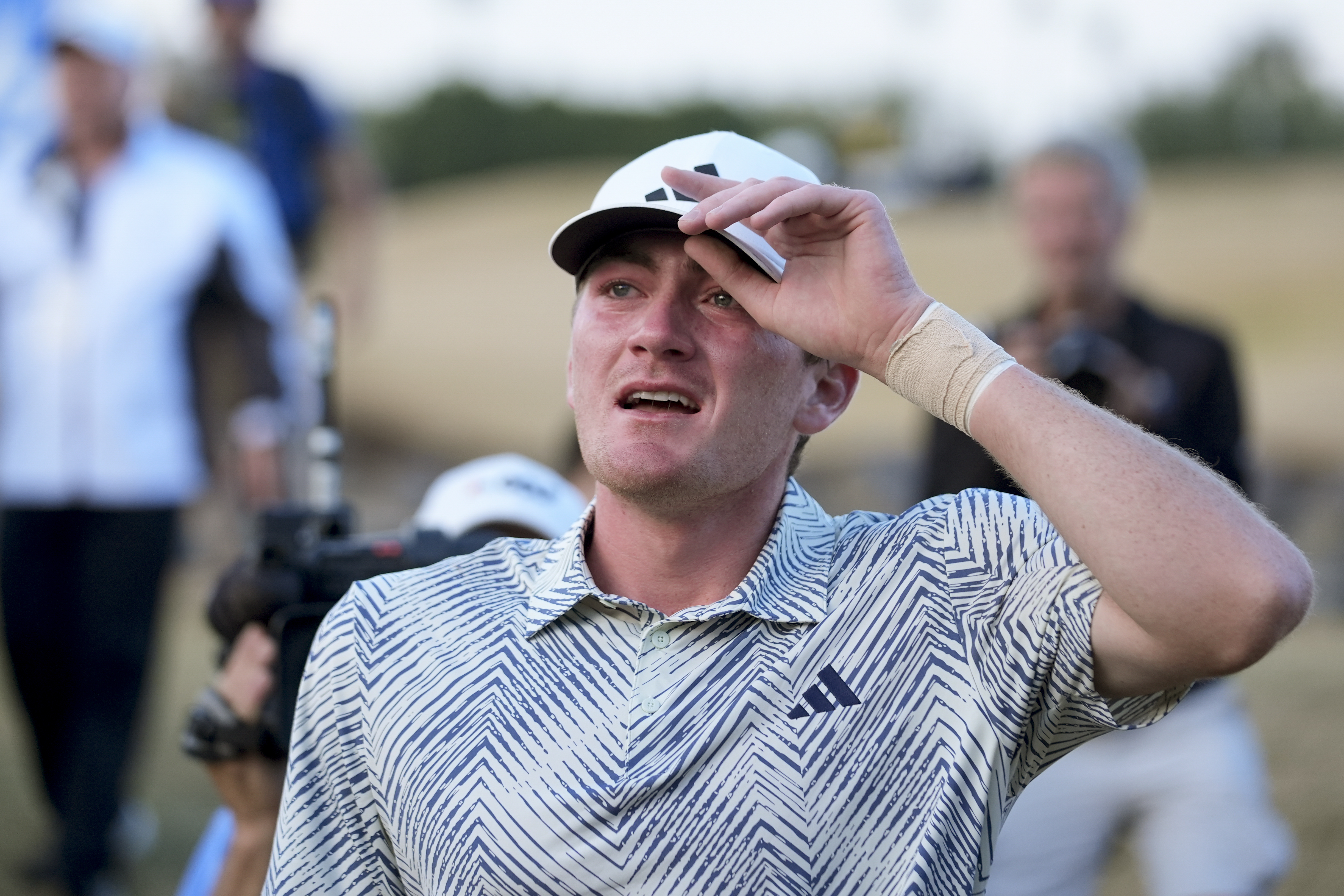 Nick Dunlap reacts after finishing on the 18th hole of the Pete Dye Stadium Course during the final round to win the American Express golf tournament, Sunday, Jan. 21, 2024, in La Quinta, Calif. 