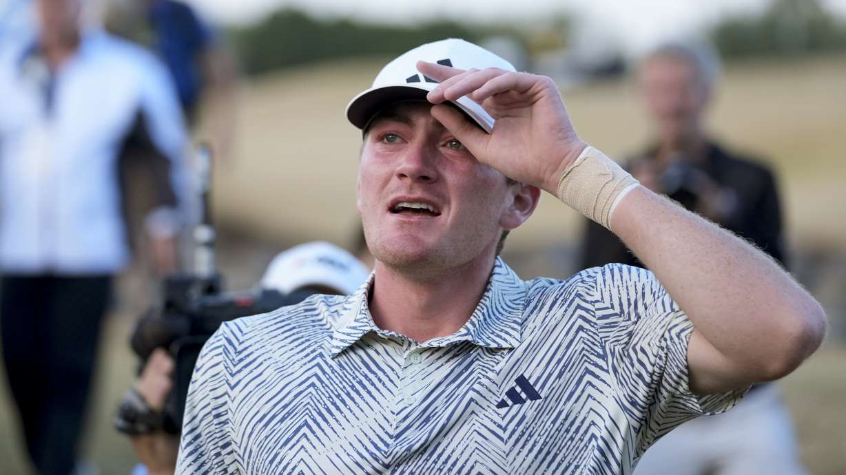 Nick Dunlap reacts after finishing on the 18th hole of the Pete Dye Stadium Course during the final round to win the American Express golf tournament, Sunday, Jan. 21, 2024, in La Quinta, Calif.