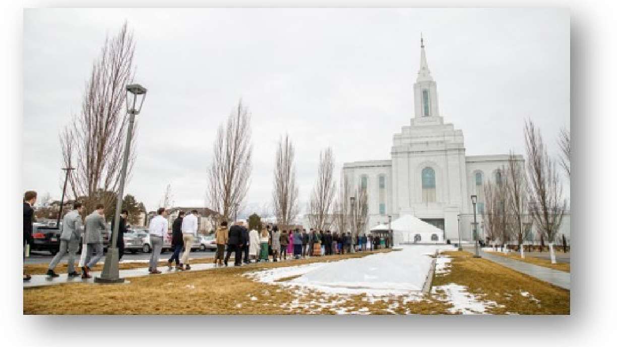 Latter-day Saints line up to attend a session of the dedication of the Orem Utah Temple on Sunday.
