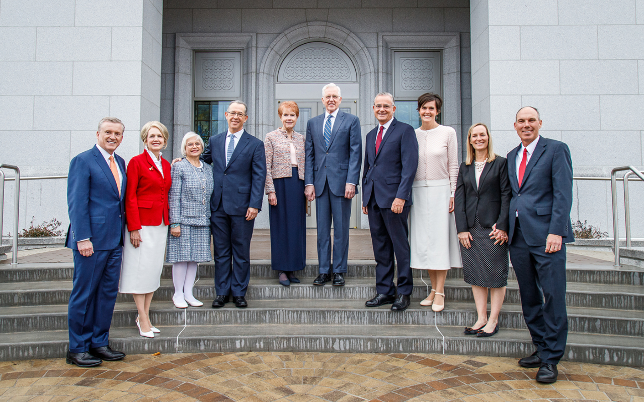 From left: Elder Kevin R. Duncan and his wife, Nancy; Elder Hugo Martinez and his wife, Nuria; Elder D. Todd Christofferson and his wife, Kathleen; Elder Patrick Kearon and his wife, Jennifer; and Elder Jonathan S. Schmitt and his wife, Alexis, in front of the Orem Utah Temple prior to its dedication on Sunday.
