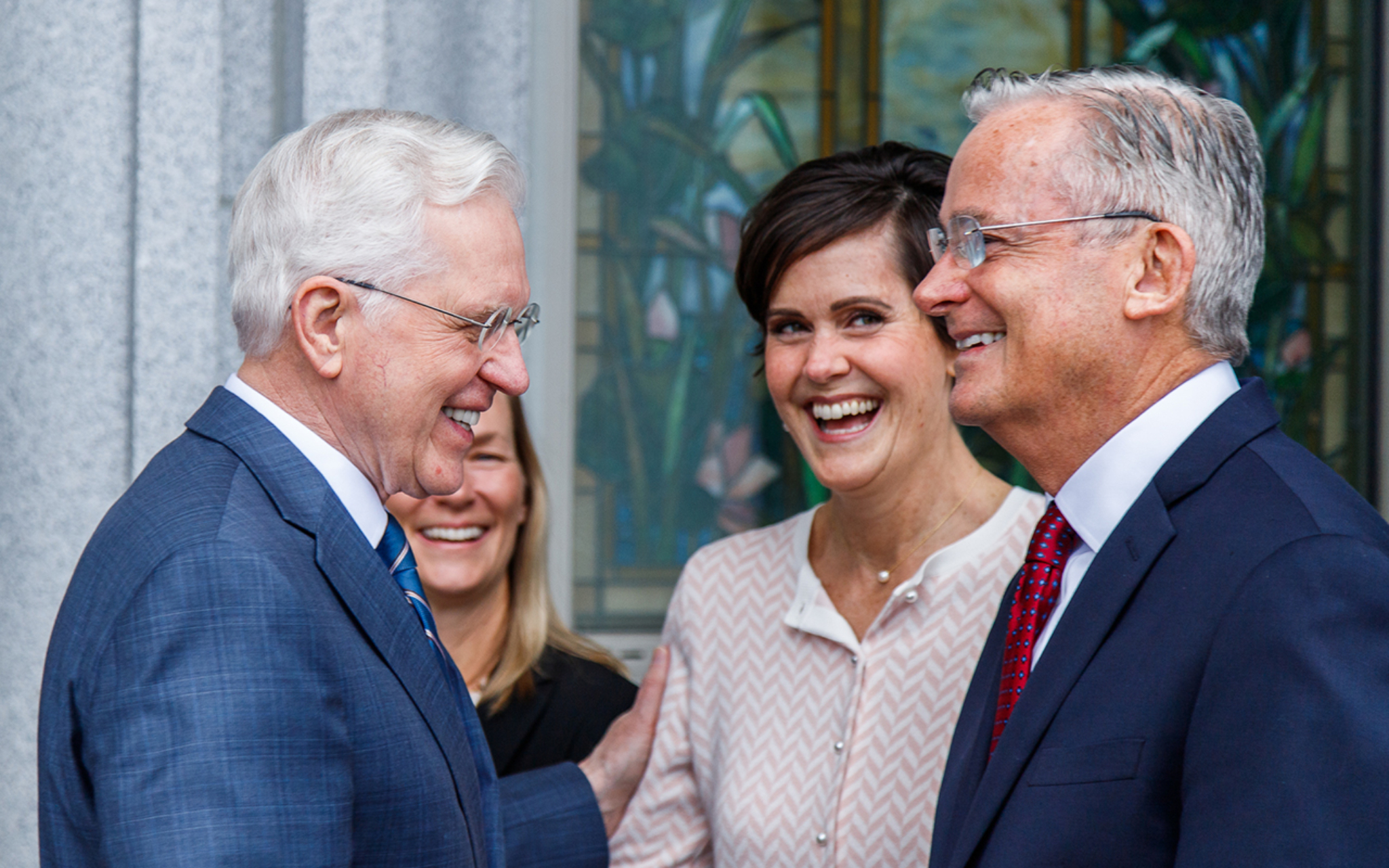 Elder D. Todd Christofferson of the Quorum of the Twelve Apostles shares a laugh with fellow Apostle Elder Patrick Kearon and his wife, Jennifer, at the Orem Utah Temple on Sunday.