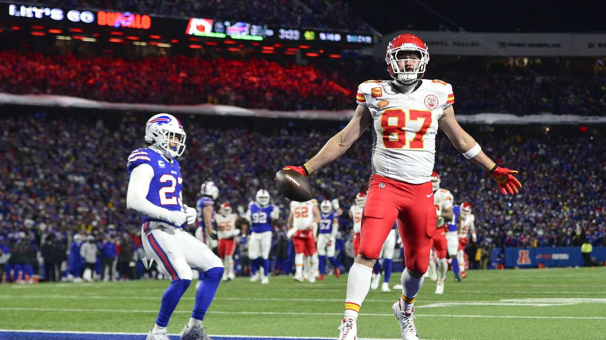 Kansas City Chiefs tight end Travis Kelce (87) scores a touchdown against the Buffalo Bills during the second quarter of an NFL AFC division playoff football game, Sunday, Jan. 21, 2024, in Orchard Park, N.Y.
