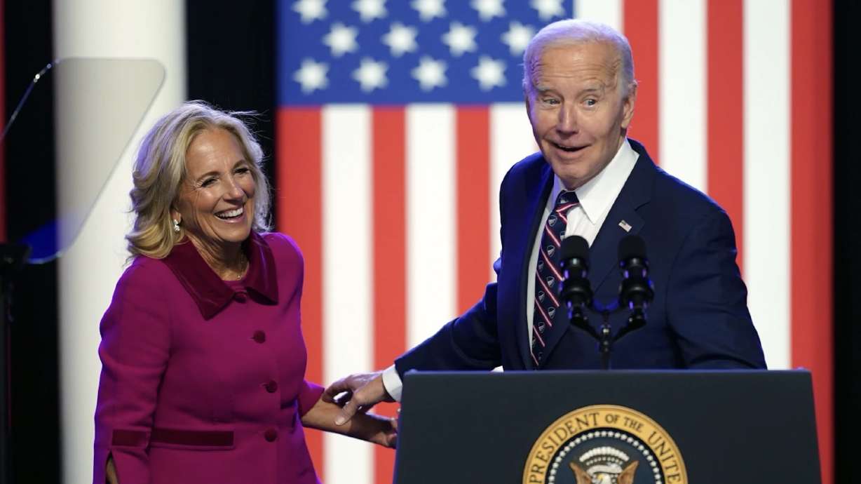 Pres. Joe Biden, right, and first lady Jill Biden, speak in Blue Bell, Pa., on Jan. 4. A robocall that appears to be an AI voice resembling President Joe Biden is advising New Hampshire residents against voting in Tuesday's presidential primary.