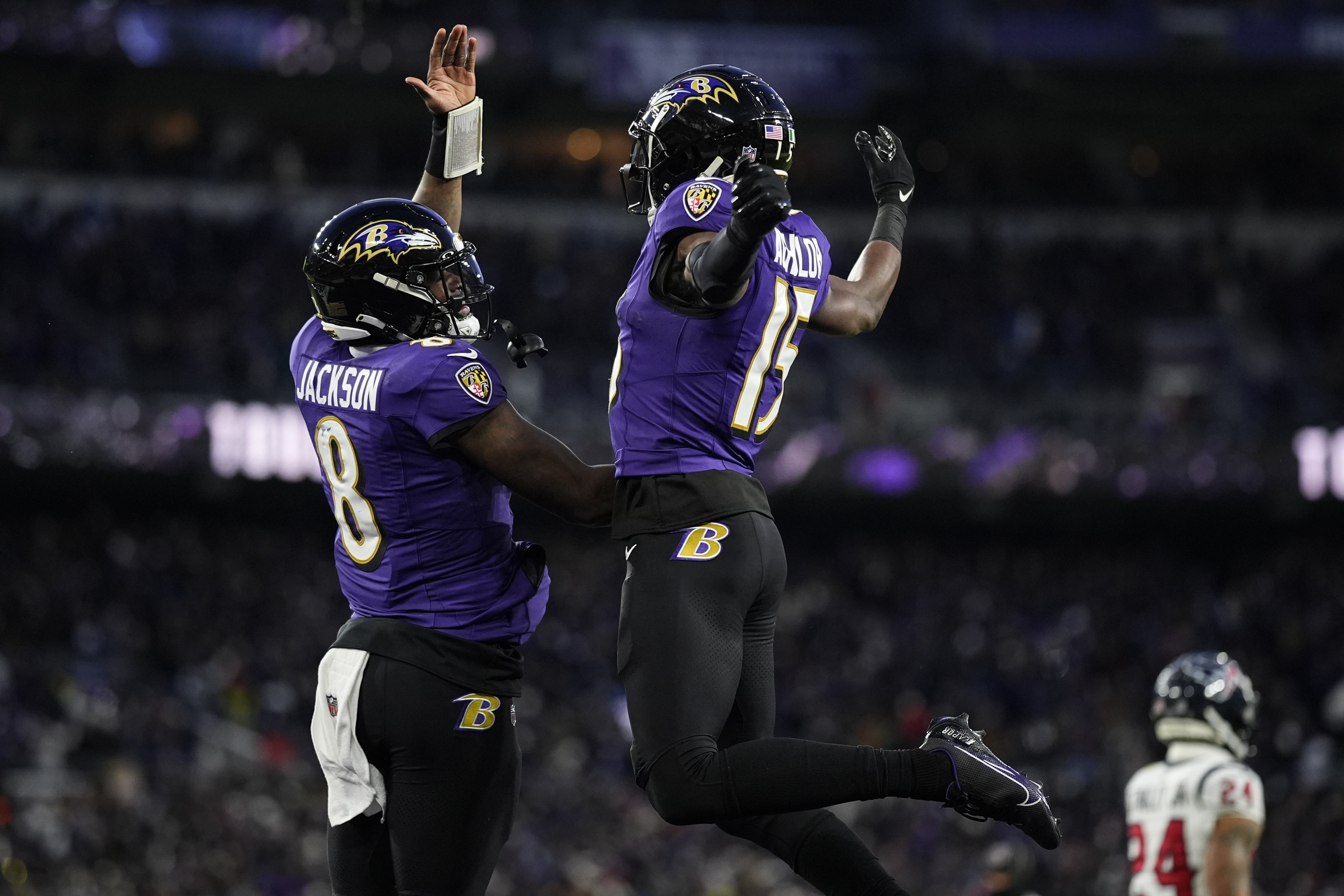 Baltimore Ravens wide receiver Nelson Agholor (15) celebrates his touchdown catch with quarterback Lamar Jackson (8) during the first half of an NFL football AFC divisional playoff game against the Houston Texans, Saturday, Jan. 20, 2024, in Baltimore. 