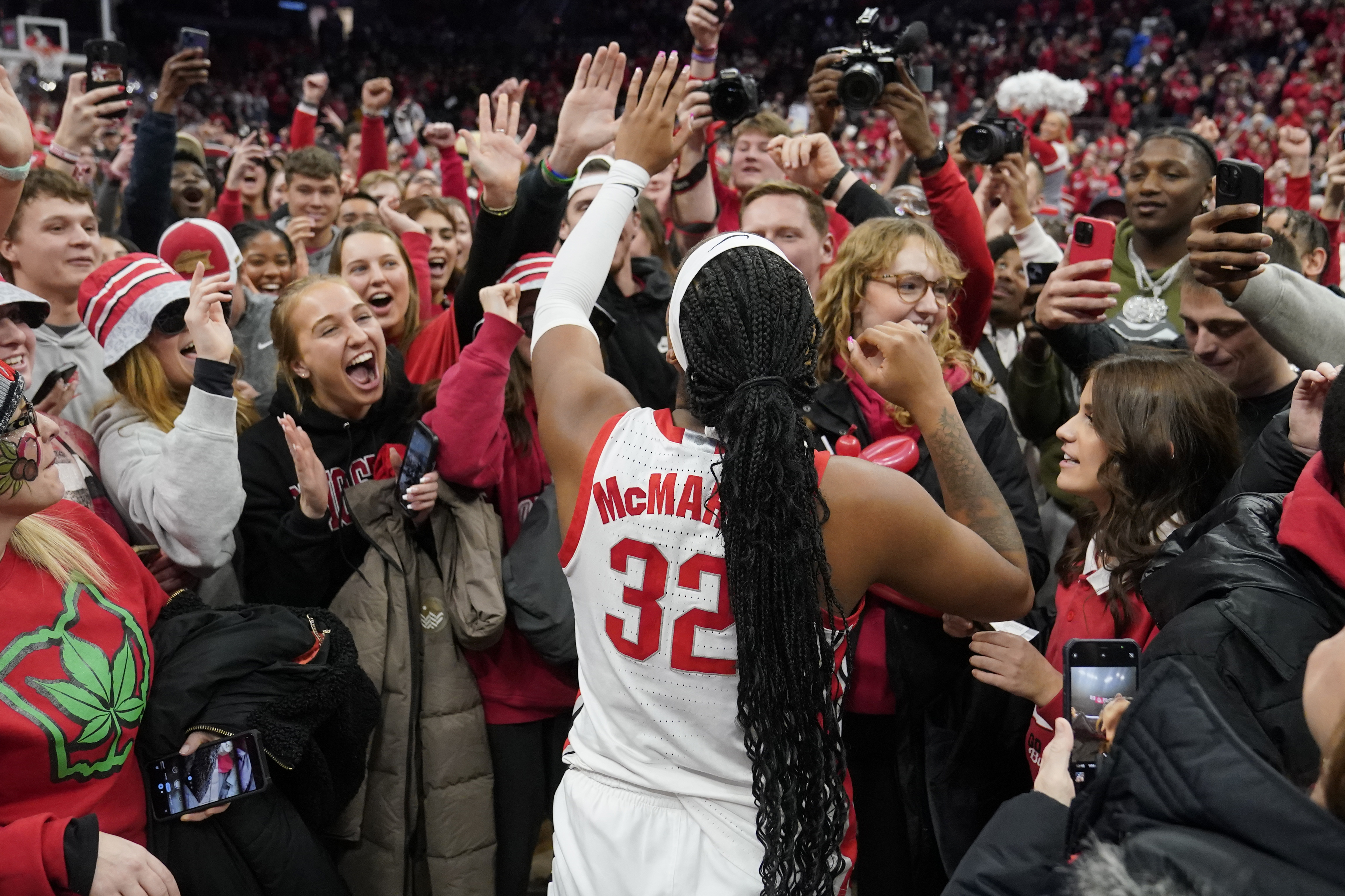Ohio State's Cotie McMahon celebrates with fans after they defeated Iowa in overtime in an NCAA college basketball game, Sunday, Jan. 21, 2024, in Columbus, Ohio. 