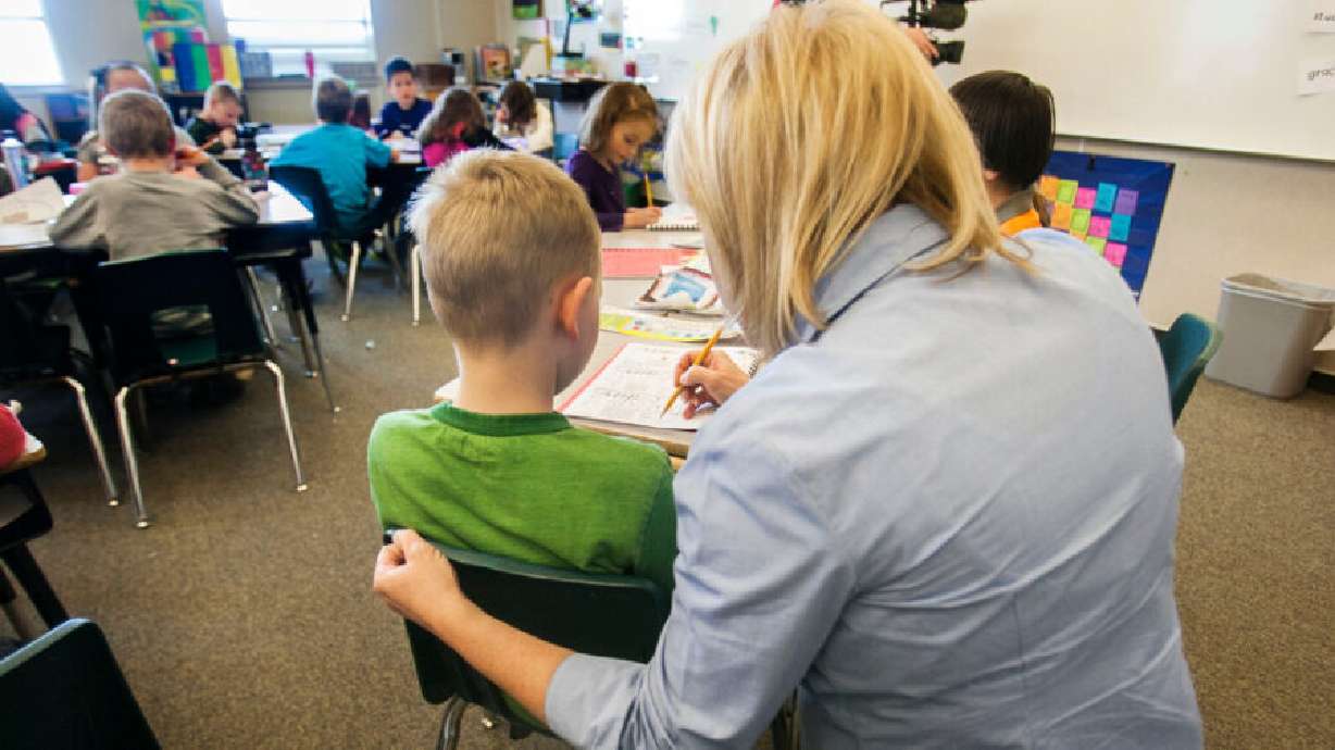 Teacher Stacey Johnsen works with her students at Daybreak Elementary, Feb. 25, 2013.