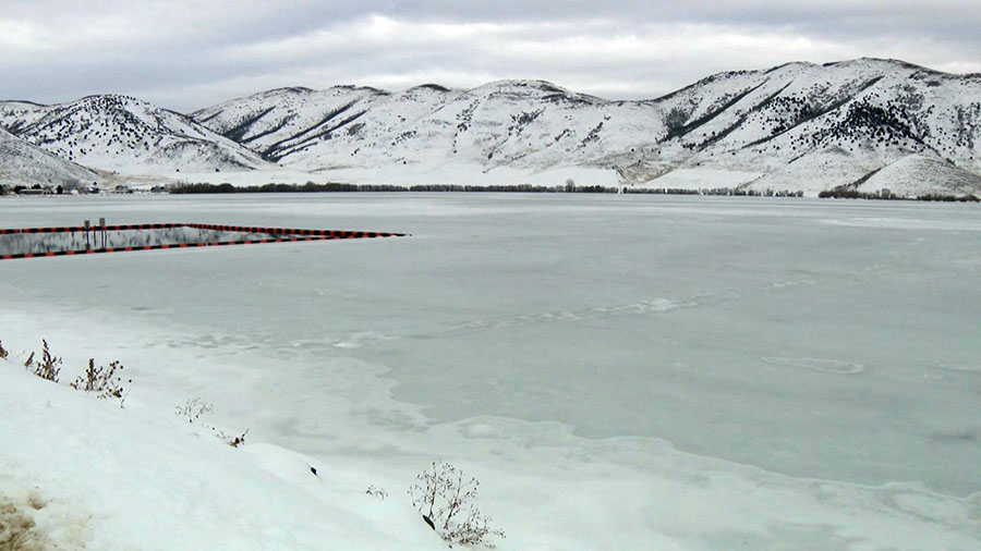 The Mantua Reservoir is shown frozen over on Monday.