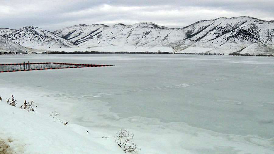 The Mantua Reservoir is shown frozen over on Monday.