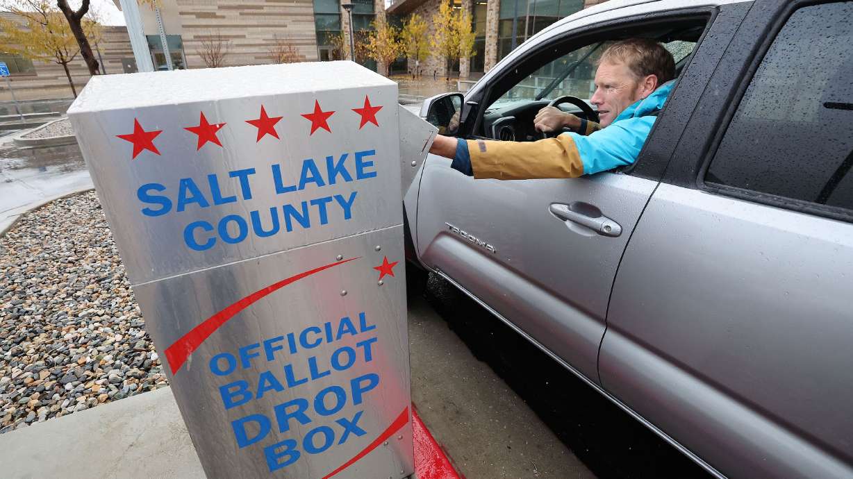 Guy Evans casts his mail in ballot in Cottonwood Heights on Nov. 8, 2022. A bill that would limit ballots counted to those returned before the polls close put on hold by legislative committee.