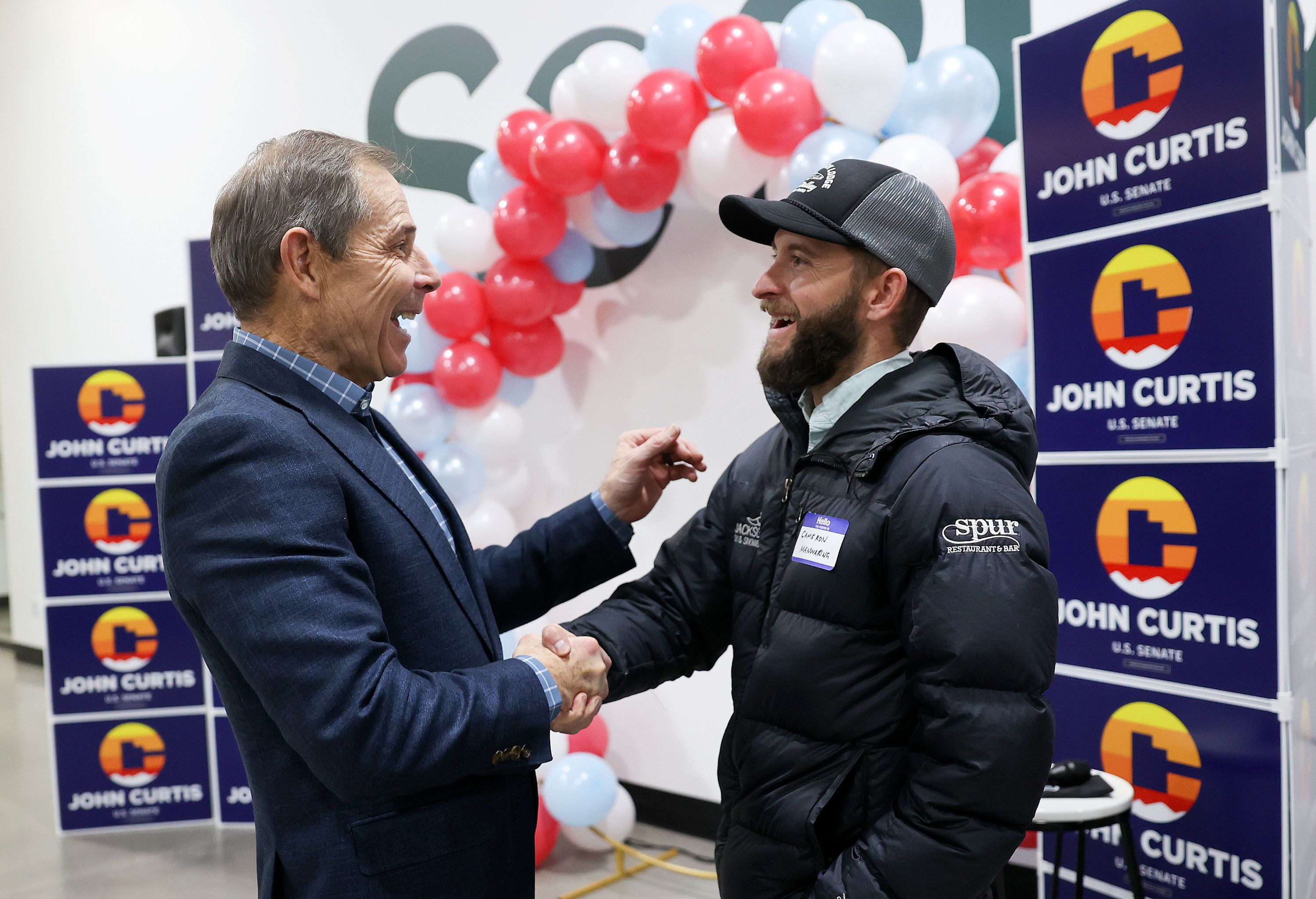 Former Rep. John Curtis, R-Utah, talks to Cameron Manwaring at an event kicking off his U.S. Senate campaign at Saela, in Orem, on Monday.