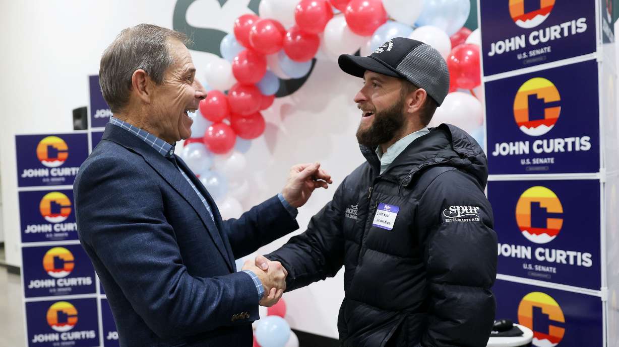 Former Rep. John Curtis, R-Utah, talks to Cameron Manwaring at an event kicking off his U.S. Senate campaign at Saela, in Orem, on Monday.