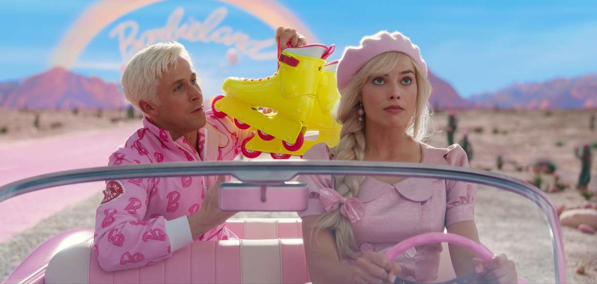 This image released by Warner Bros. Pictures shows Ryan Gosling, left, and Margot Robbie in a scene from "Barbie."