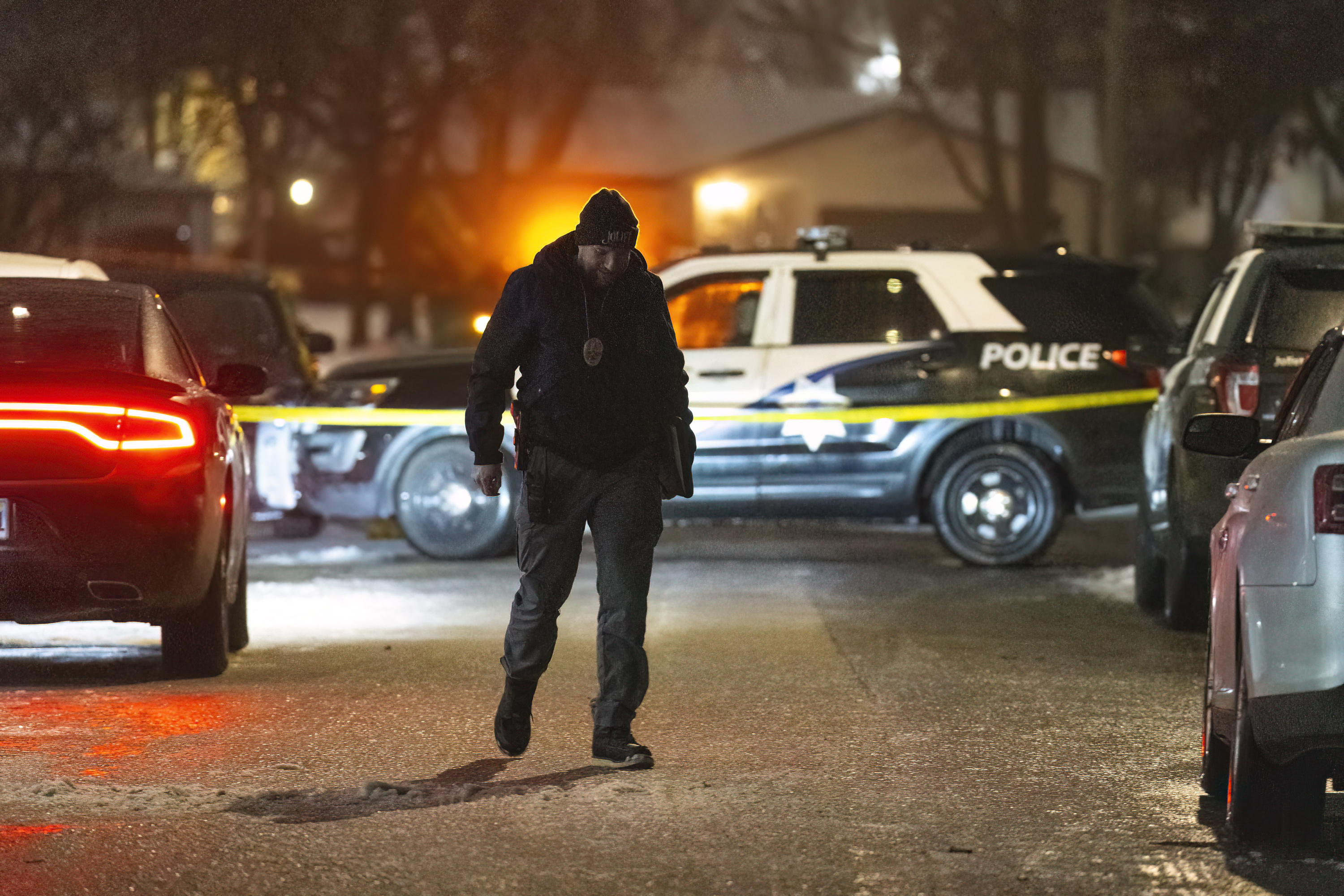 Police work a scene, Monday in Joliet, Ill., after multiple people were shot and killed over two days at three locations in the Chicago suburbs. 