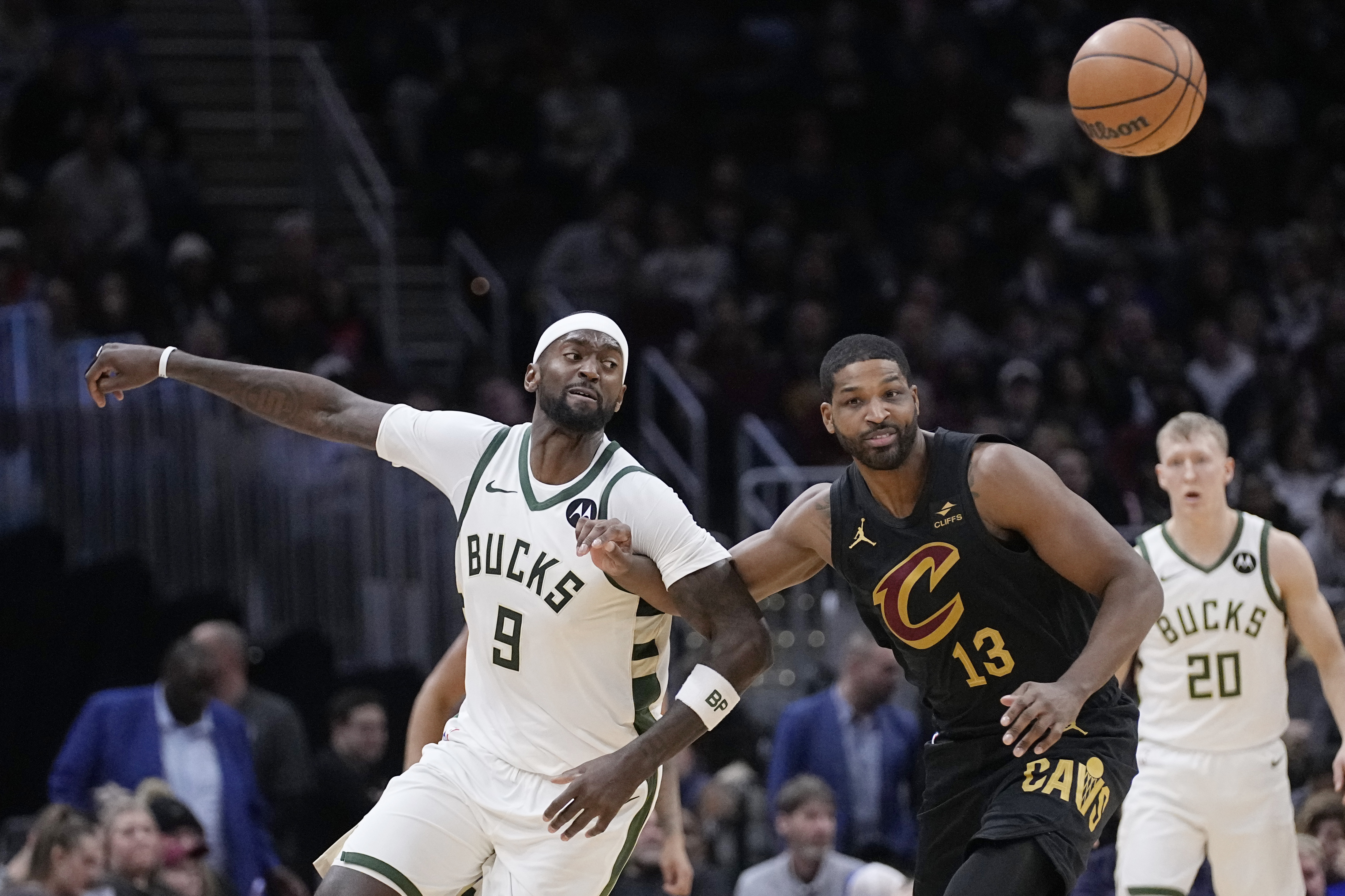 Milwaukee Bucks forward Bobby Portis (9) and Cleveland Cavaliers center Tristan Thompson (13) watch the ball during the second half of an NBA basketball game Wednesday, Jan. 17, 2024, in Cleveland.