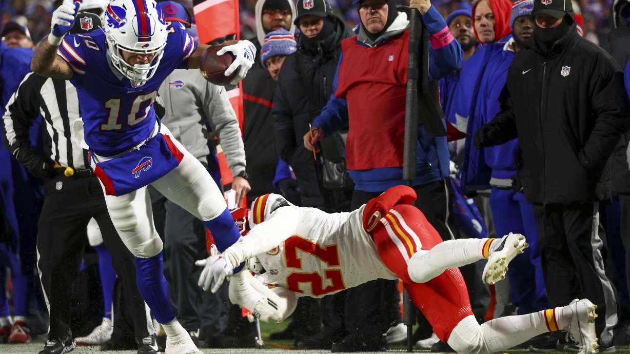 Buffalo Bills wide receiver Khalil Shakir (10) is pulled out of bounds by Kansas City Chiefs safety Chamarri Conner (27) during the fourth quarter of an NFL AFC division playoff football game, Sunday, Jan. 21, 2024, in Orchard Park, N.Y.