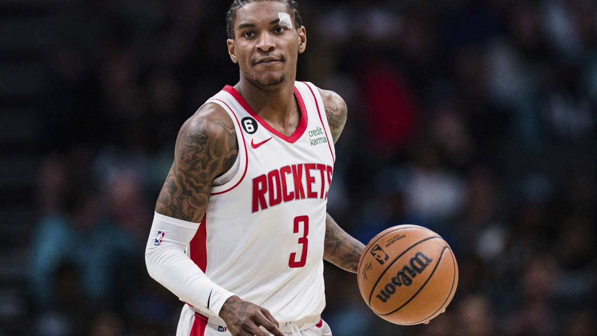 FILE - Houston Rockets guard Kevin Porter Jr. (3) brings the ball up court against the Charlotte Hornets during the second half of an NBA basketball game in Charlotte, N.C., Friday, April 7, 2023. Former Houston Rockets guard Kevin Porter Jr. has reached a plea deal in a New York City domestic assault case that will keep him out of jail if he completes a court-ordered treatment program and stays out of trouble. Porter, 23, pleaded guilty Tuesday, Jan. 23, 2024, to misdemeanor assault and a harassment violation in connection with an incident last September at a Manhattan hotel.