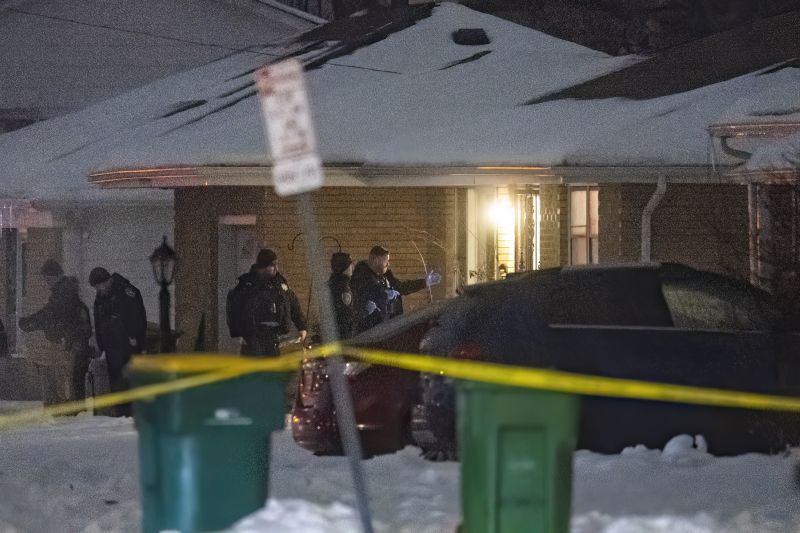 Police work a scene Monday in Joliet, Ill., after multiple people were shot and killed over two days at three locations in the Chicago suburbs.